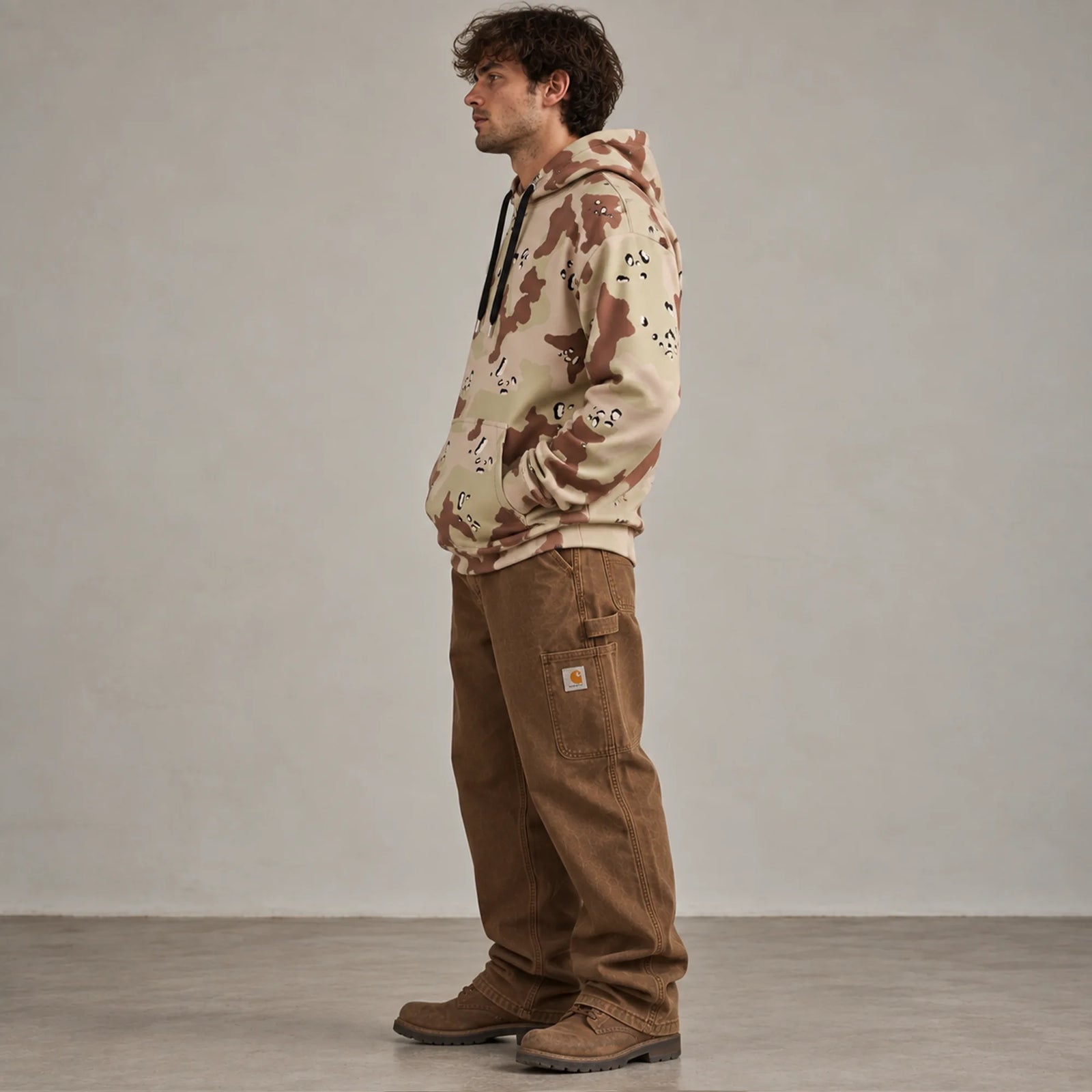 Six-color desert camouflage hoodie side profile showing relaxed fit and structured heavyweight drape