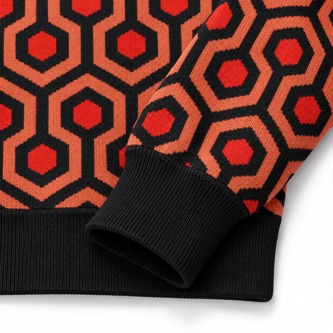 Close-up of Overlook Knit Hoodie sleeve showing geometric pattern and black ribbed cuff