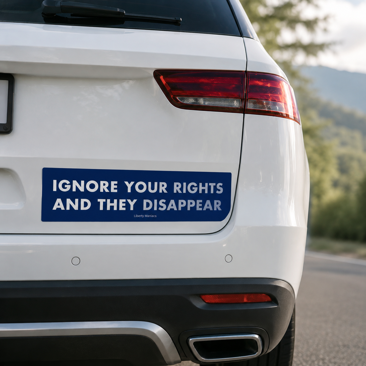Ignore your rights and they disappear blue jumbo bumper sticker by Liberty Maniacs on a white SUV tailgate.