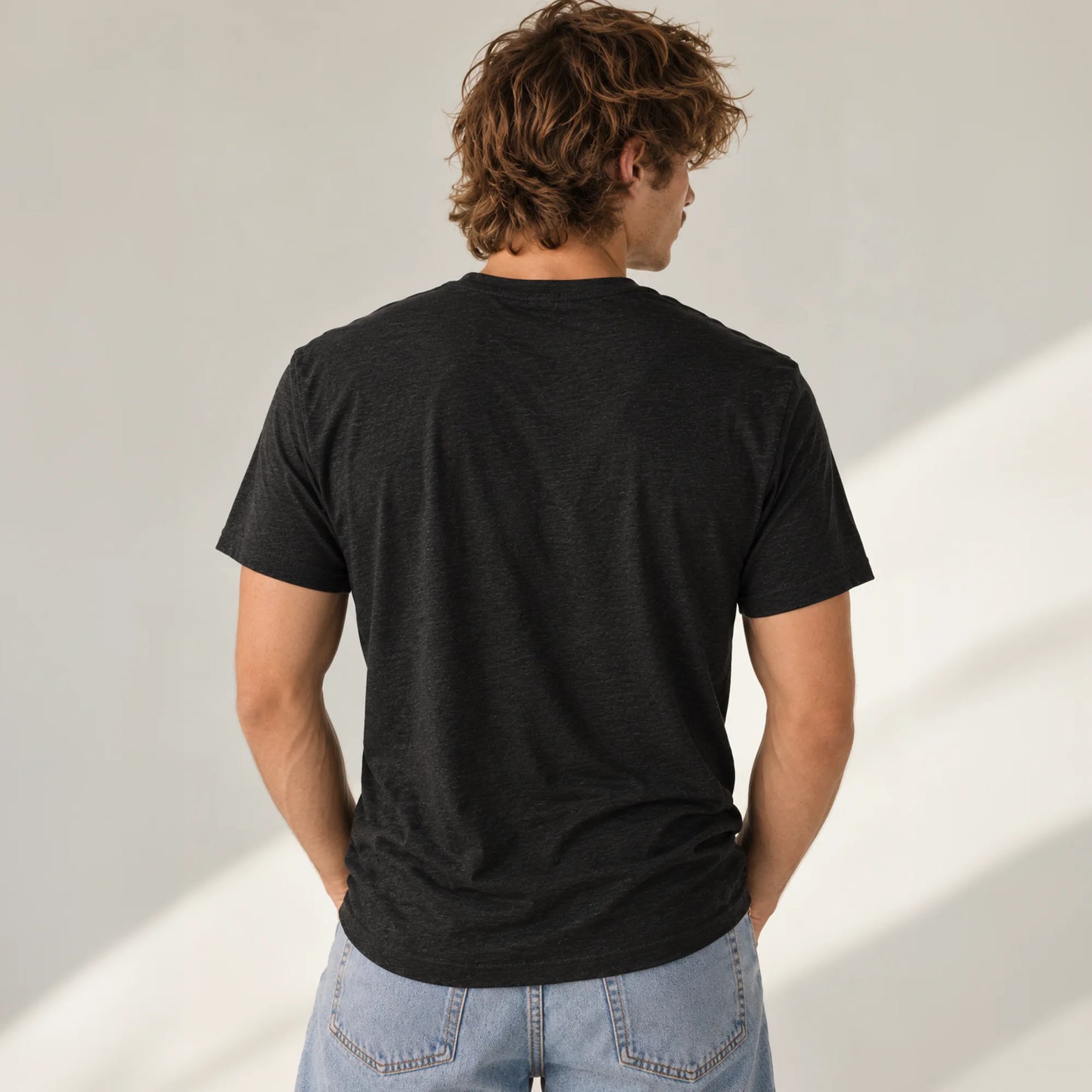 Political Advisory black tri-blend T-shirt back view