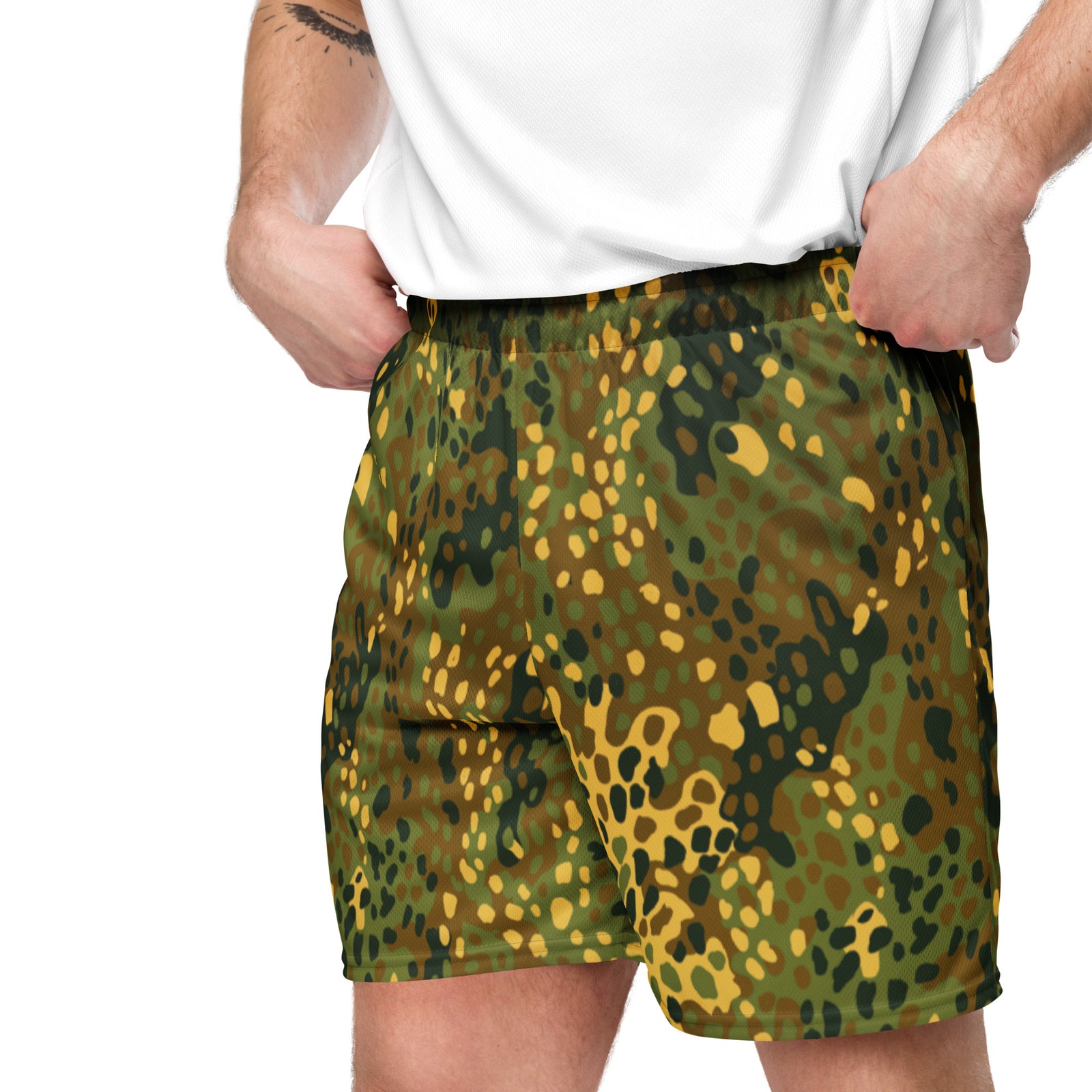 Person wearing green and yellow camouflage shorts on a white background
