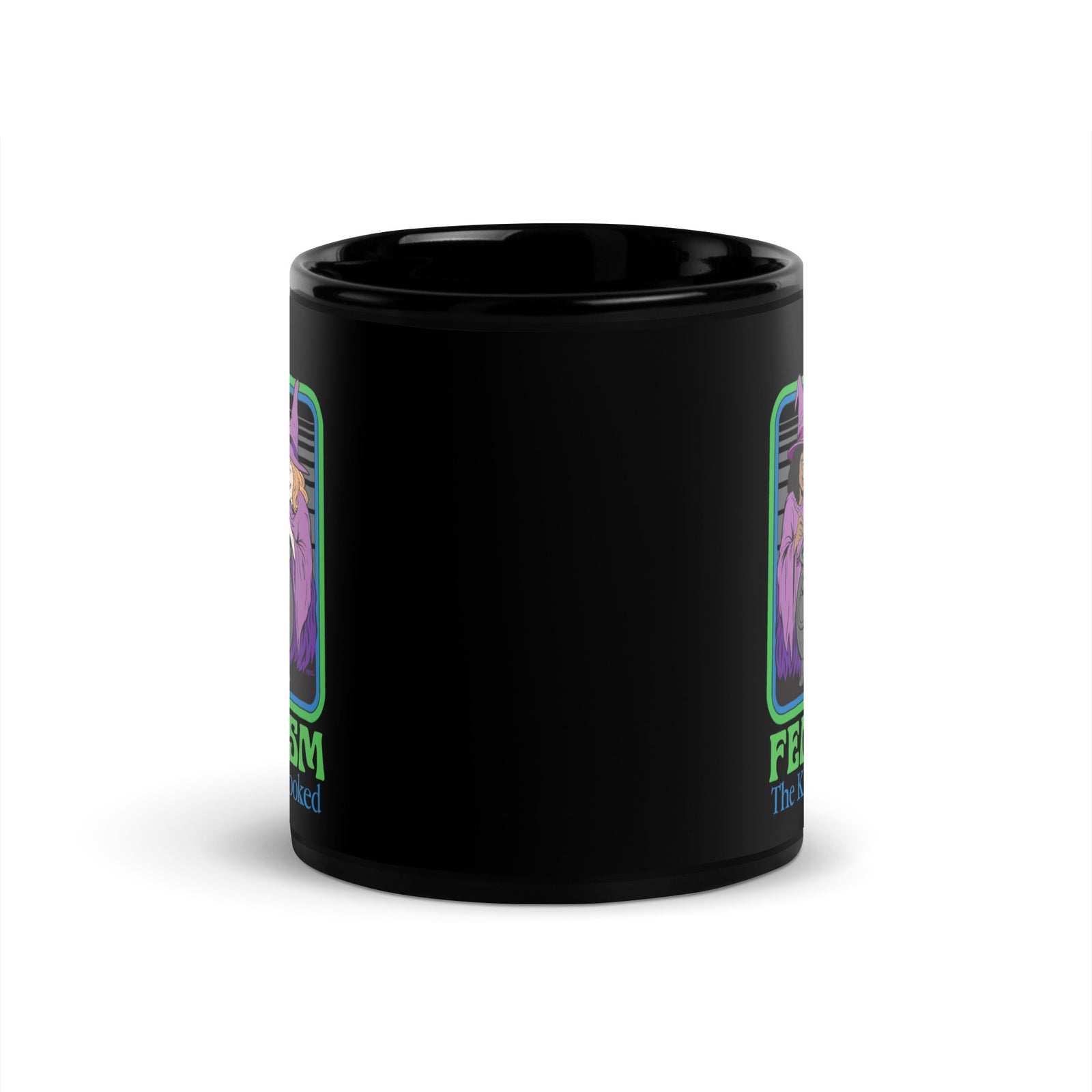 Black mug featuring a colorful “Feminism: The Kids Are Cooked” design with three witches around a green cauldron and a nervous child inside.