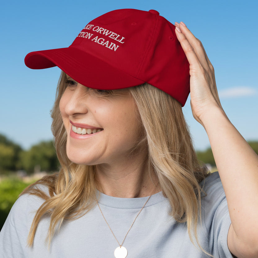 Woman wearing a red cap with a logo on a white background