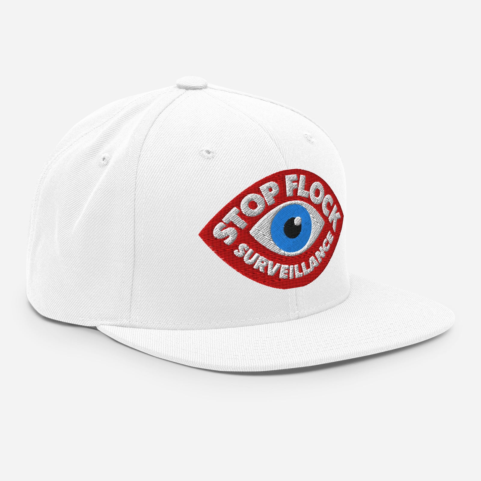A white flat-brim snapback cap featuring a red embroidered patch with a blue eye and the text 'STOP FLOCK SURVEILLANCE' on the front.