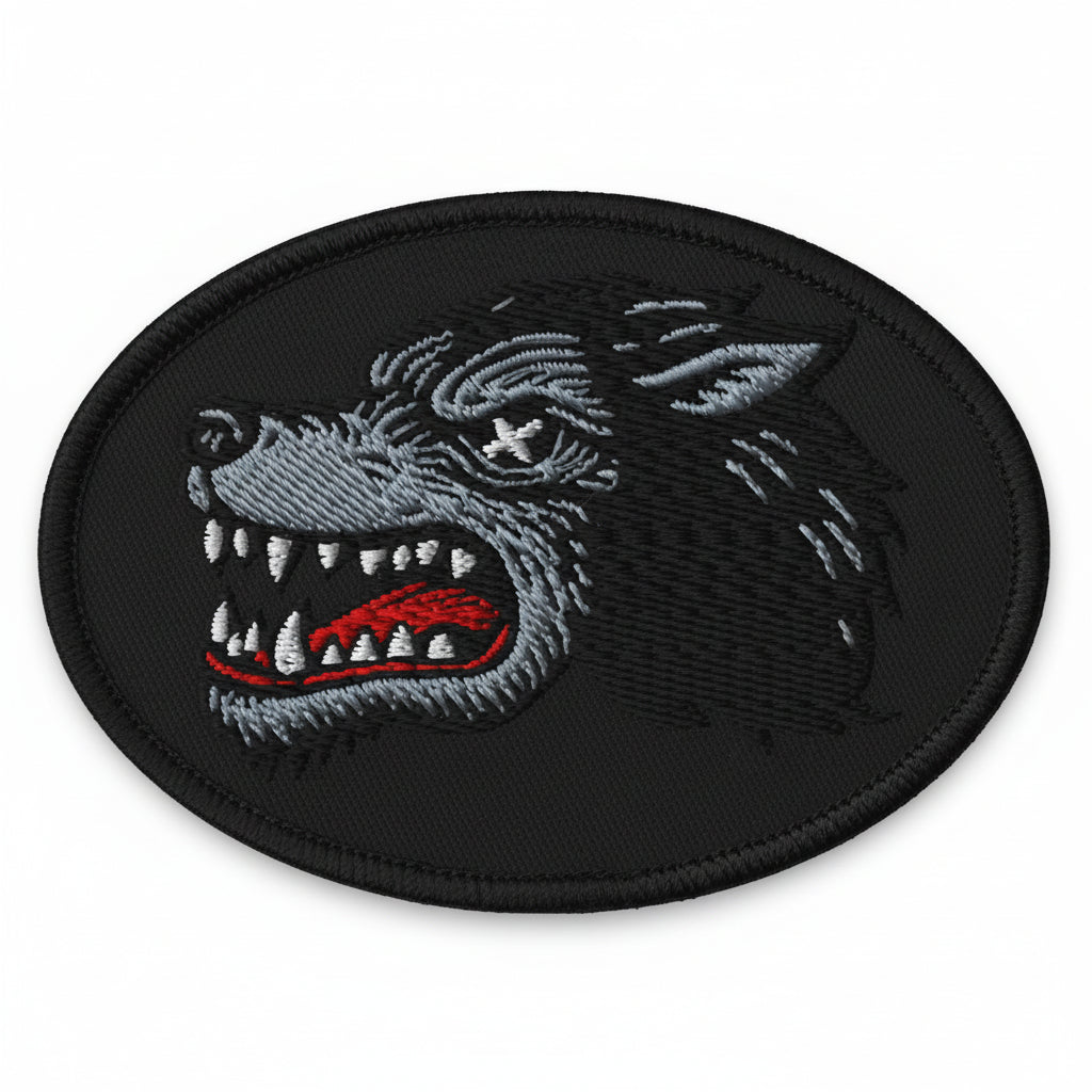 Embroidered patch of a wolf's head on a black background