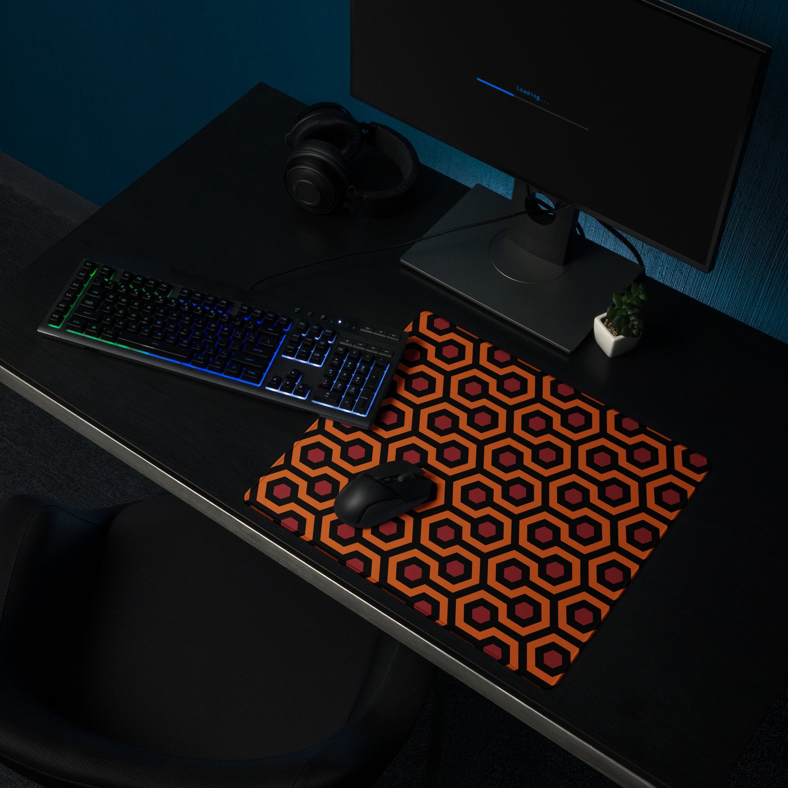 Compact 18 by 16 inch Overlook carpet gaming desk mat with mouse at a dark computer setup