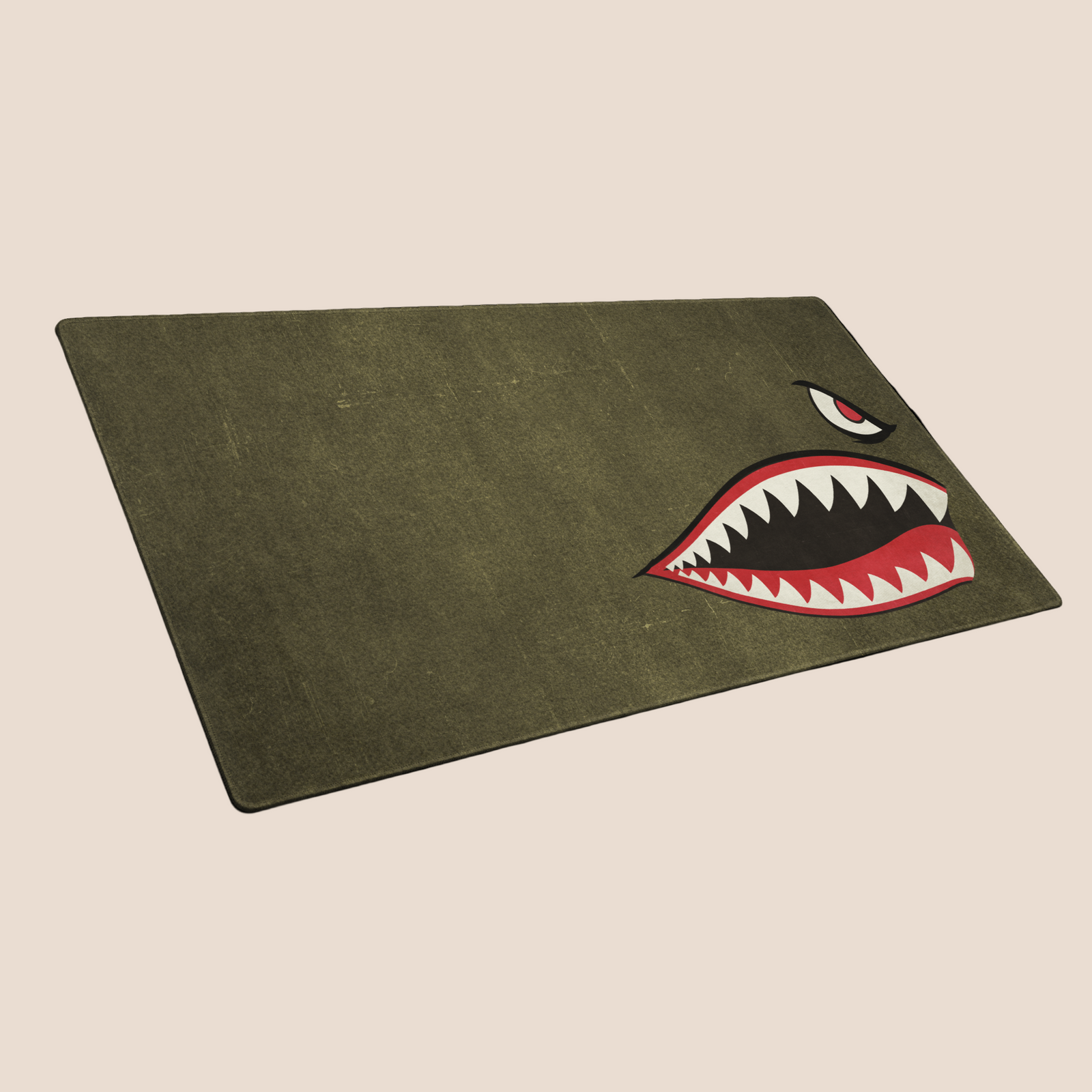Green mat with a shark mouth graphic on a white background