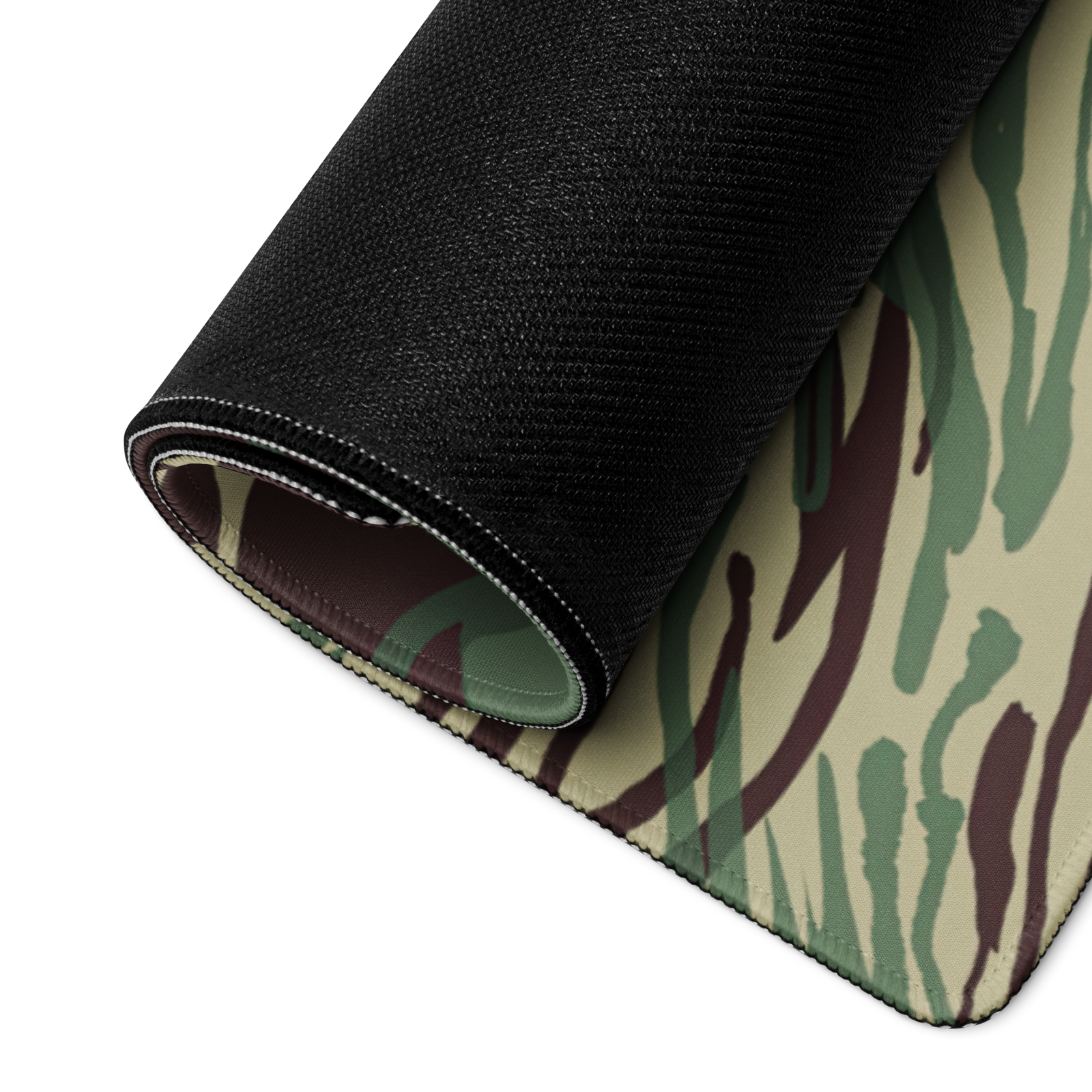Roll of black fabric and camouflage-patterned fabric on a white background
