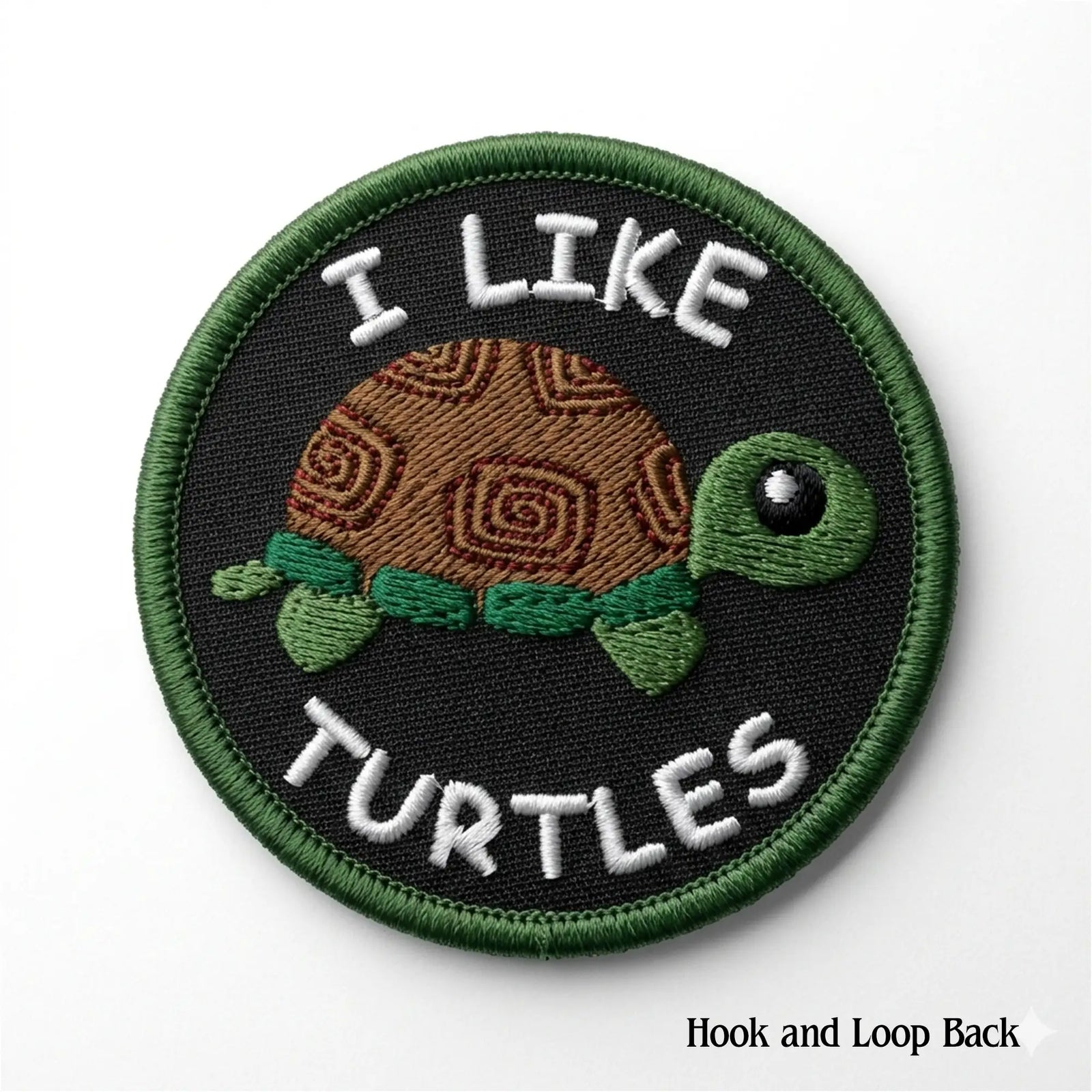 Embroidered patch with a turtle design and text 'I Like Turtles' on a black background.