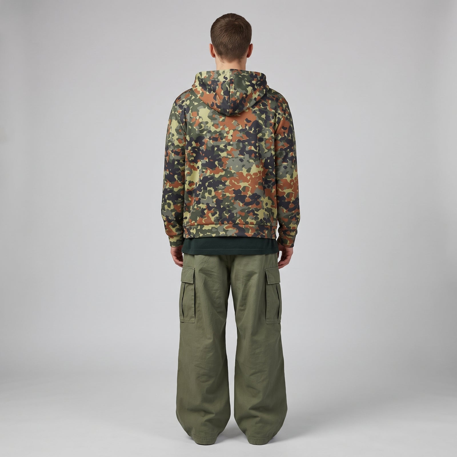 Man wearing the Flecktarn Reconnaissance camo zip hoodie, back view
