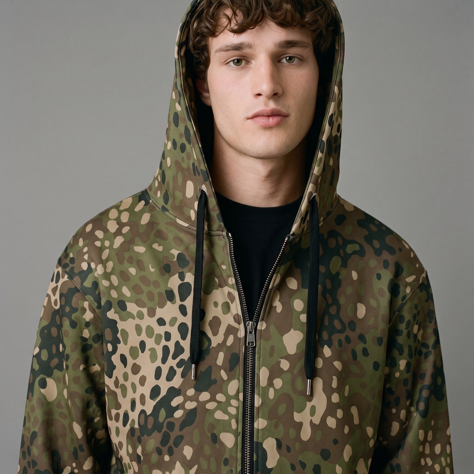 Close-up of man wearing the Field Green Erbsenmuster Pea Dot zip hoodie