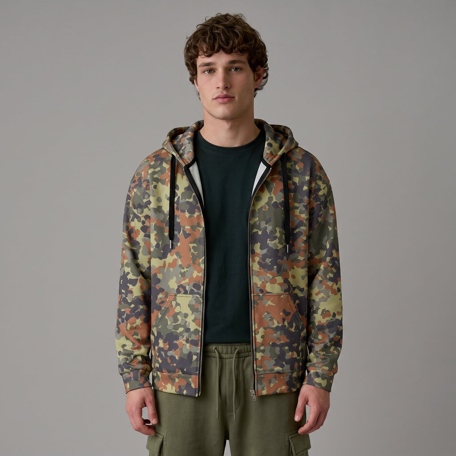 Man wearing the Flecktarn Reconnaissance camo zip hoodie, half-length front view