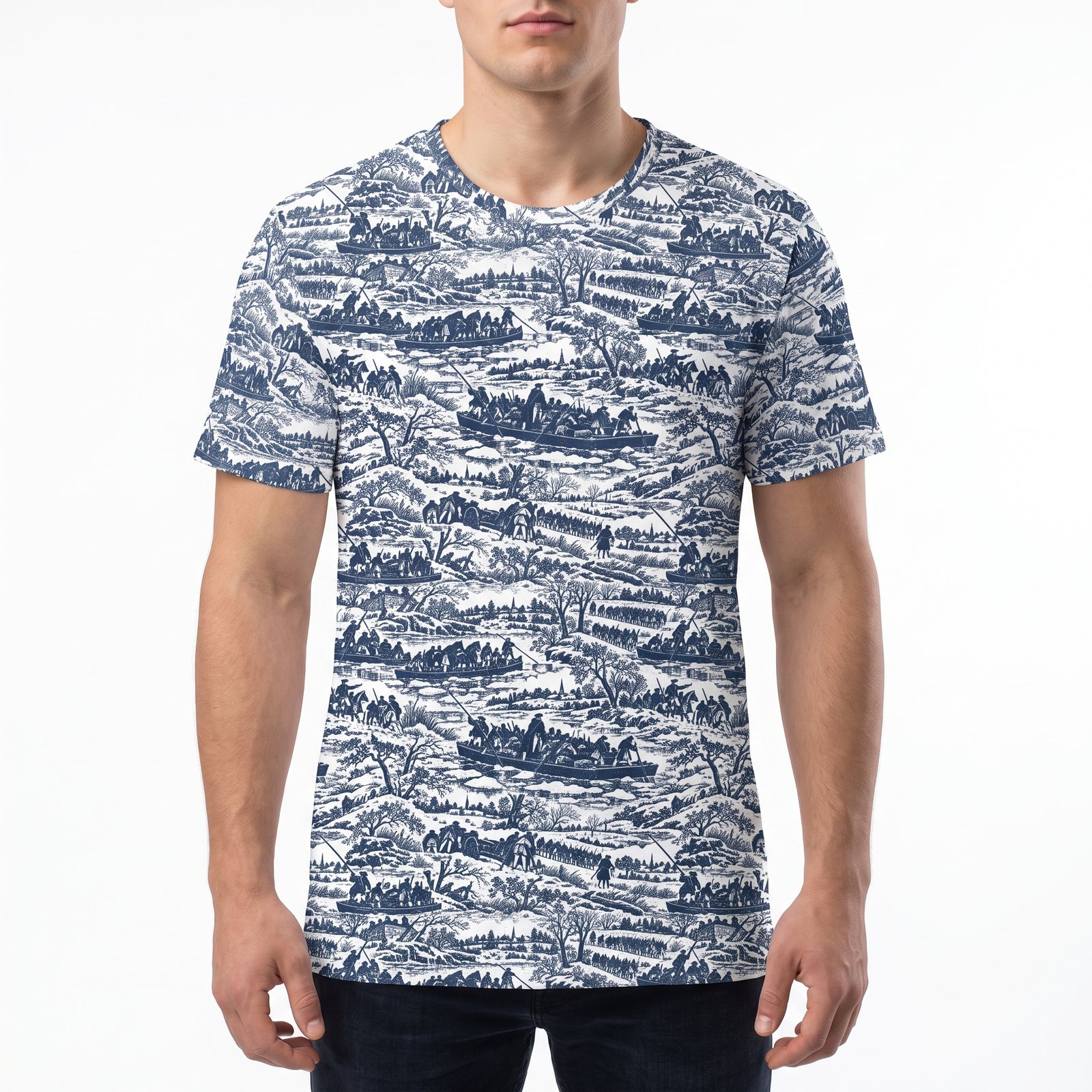 A man wearing a short-sleeve crewneck t-shirt with a detailed blue and white toile-style landscape pattern, shown against a plain white background.