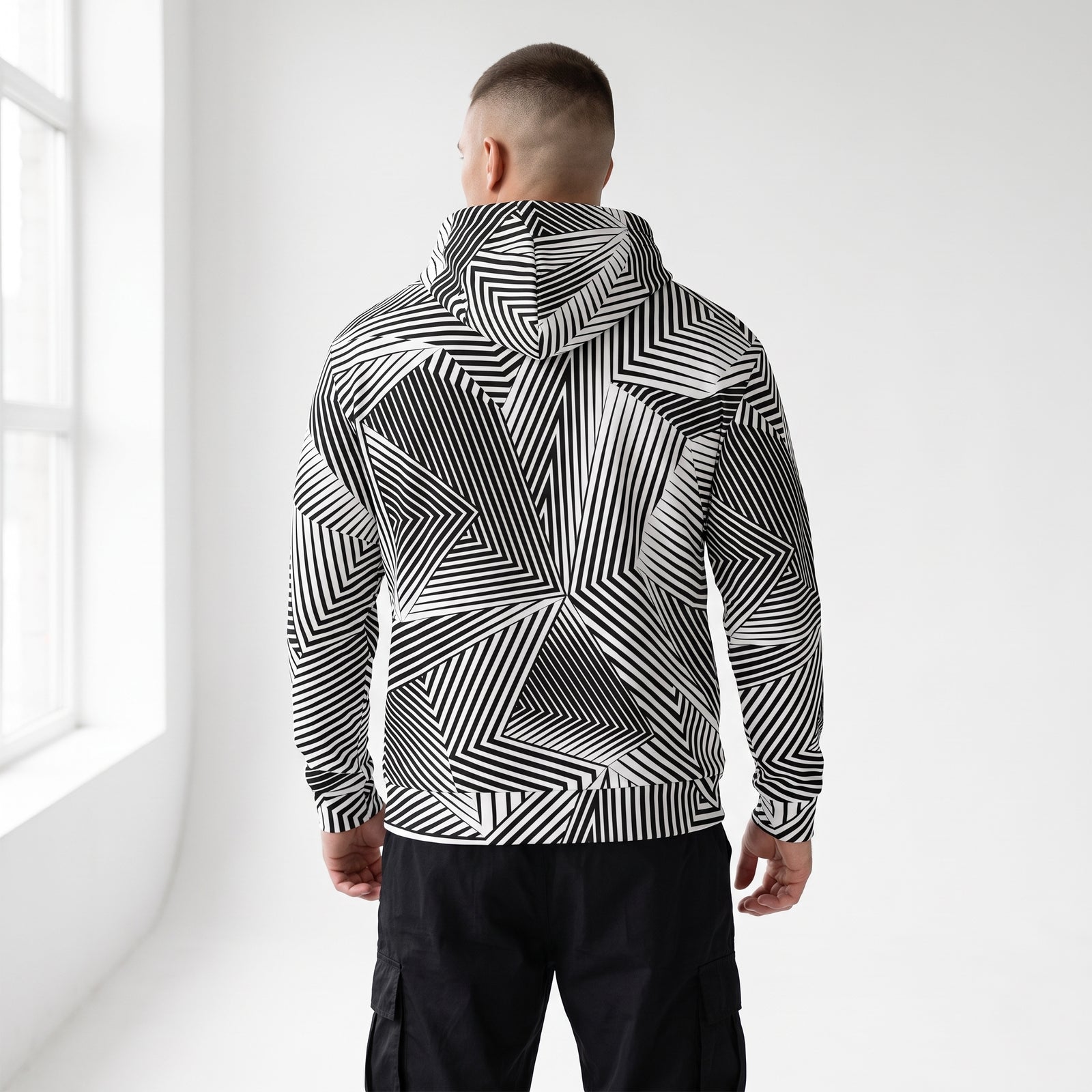 Over-the-shoulder view of the Dazzle naval camouflage zip hoodie
