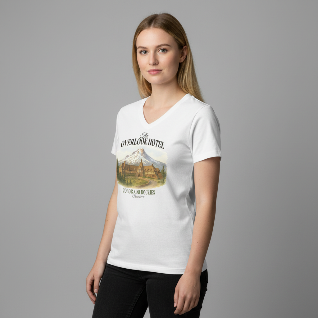 Woman wearing a white t-shirt with 'Overlook Hotel' graphic design on a gray background