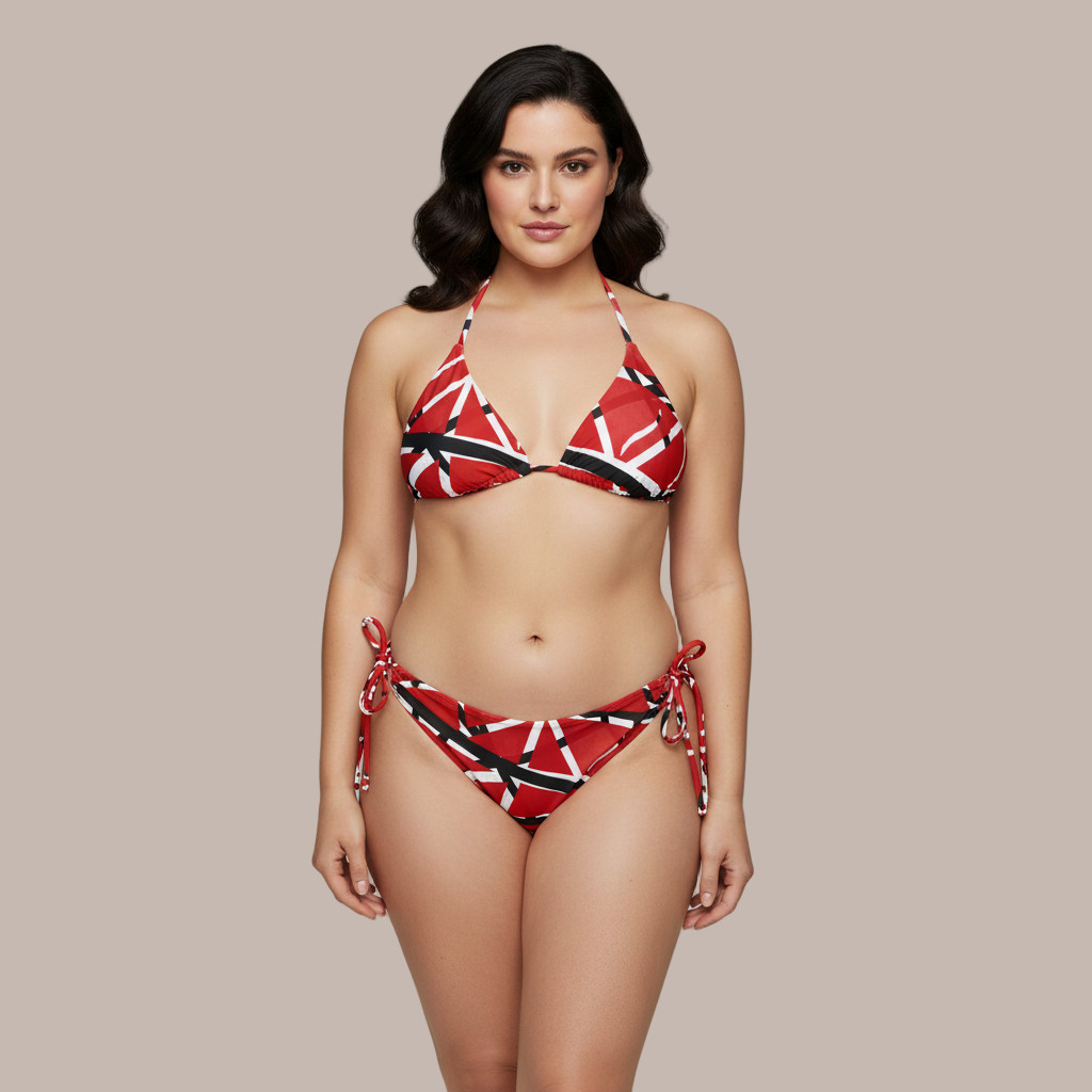 Woman wearing a red and black patterned bikini against a gray background