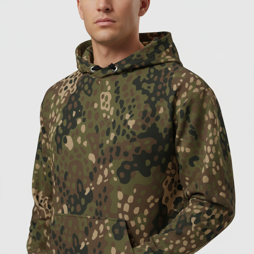 Person wearing a camouflage hoodie on a plain background