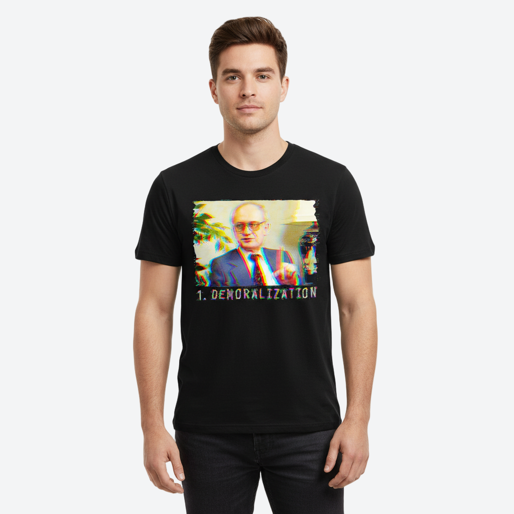 Man wearing a black t-shirt with a graphic design on a white background