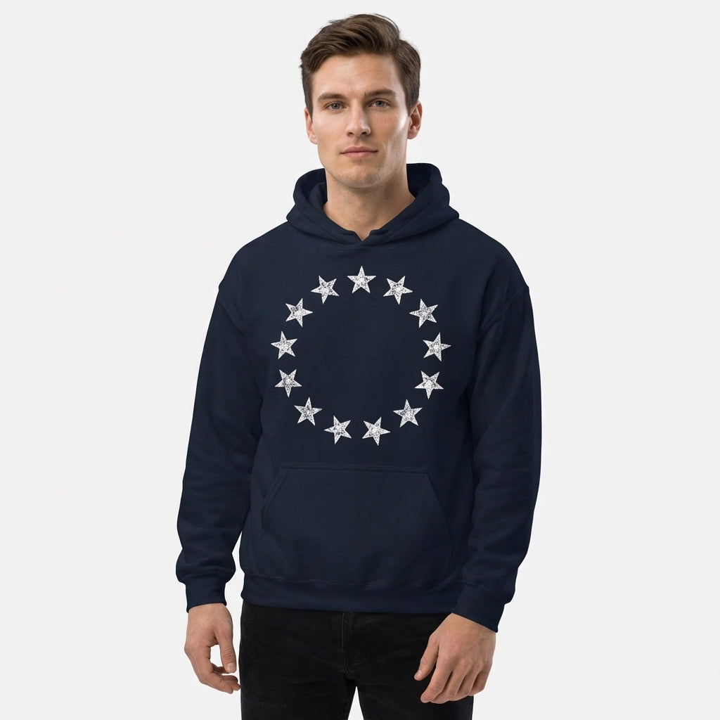 Man wearing a navy blue hoodie with a star design on a white background