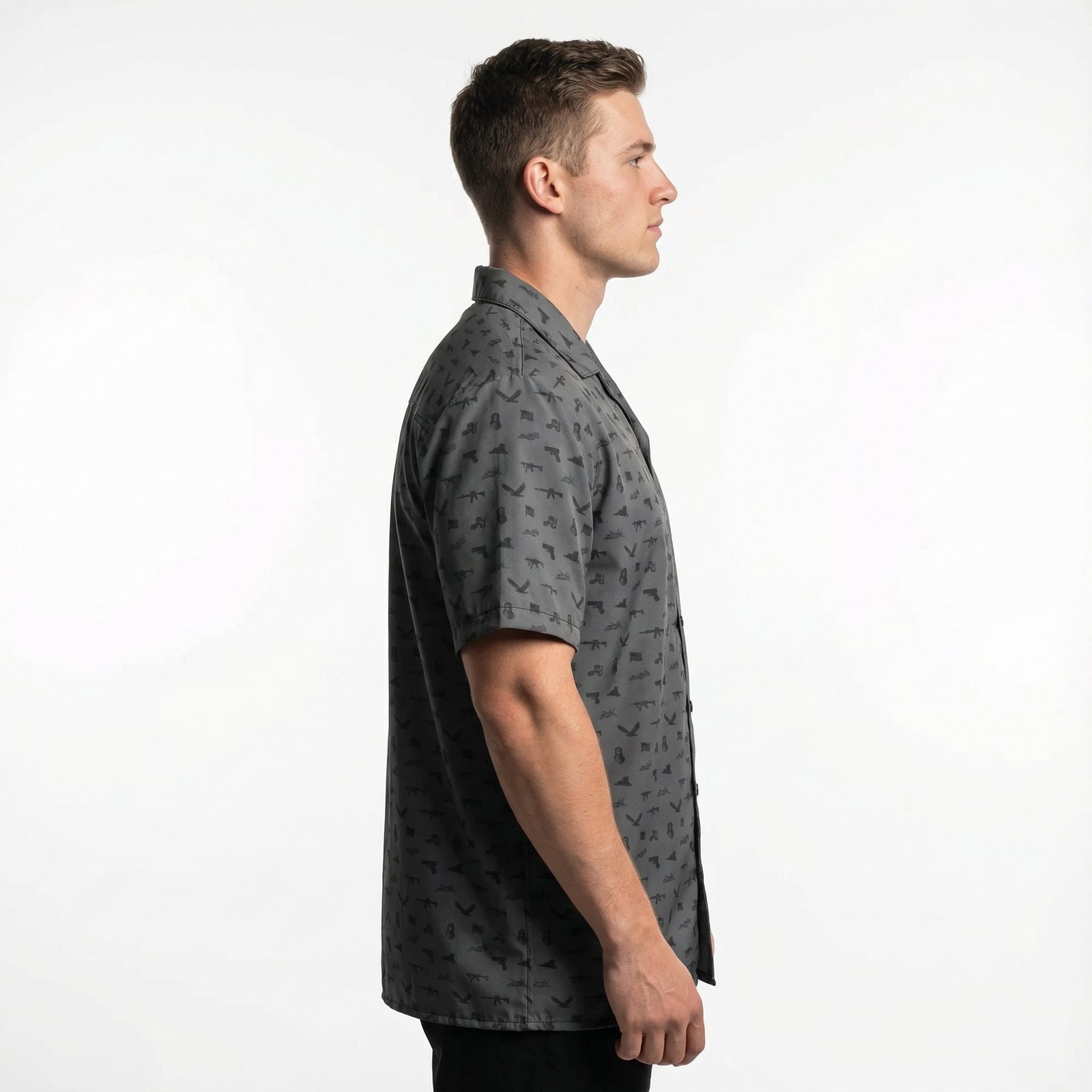 Man wearing a gray patterned shirt on a white background