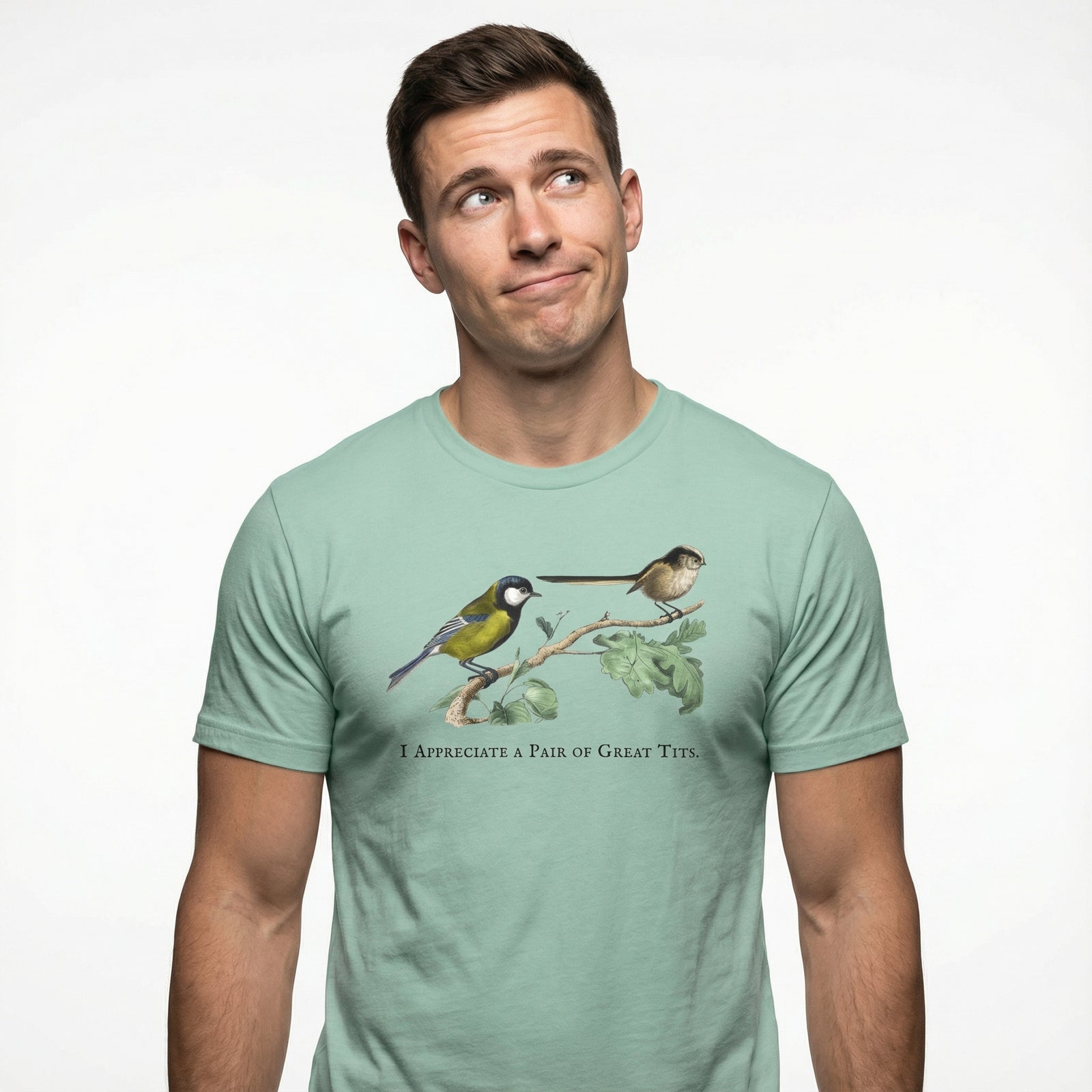 Man wearing a light green t-shirt with bird design and text on a white background
