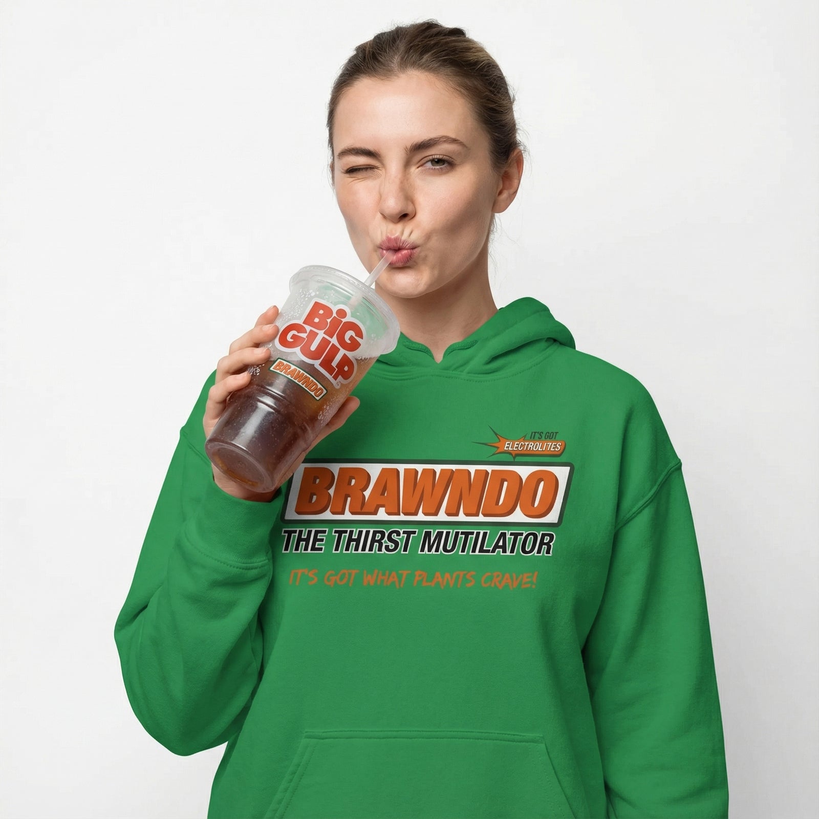Person wearing a green hoodie with text and holding a cup, on a white background
