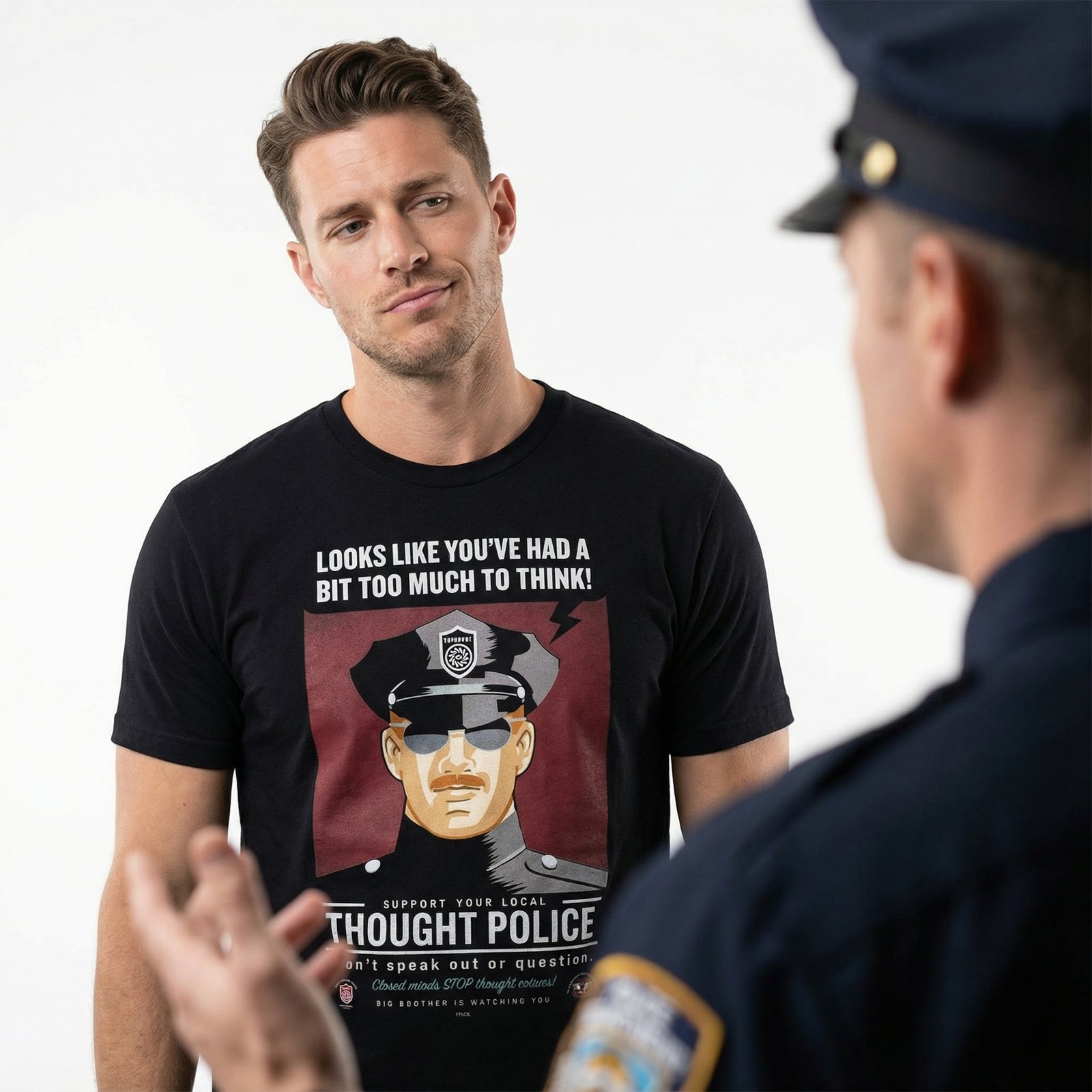 Man wearing a black t-shirt with a thought police graphic and text that say, 'Looks Like You've Had a Bit Too Much to Think', standing next to a police officer.
