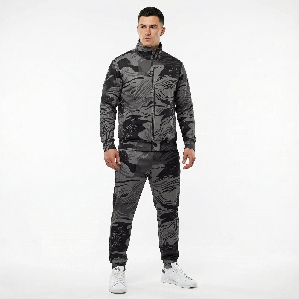 Man wearing a camouflage tracksuit on a white background