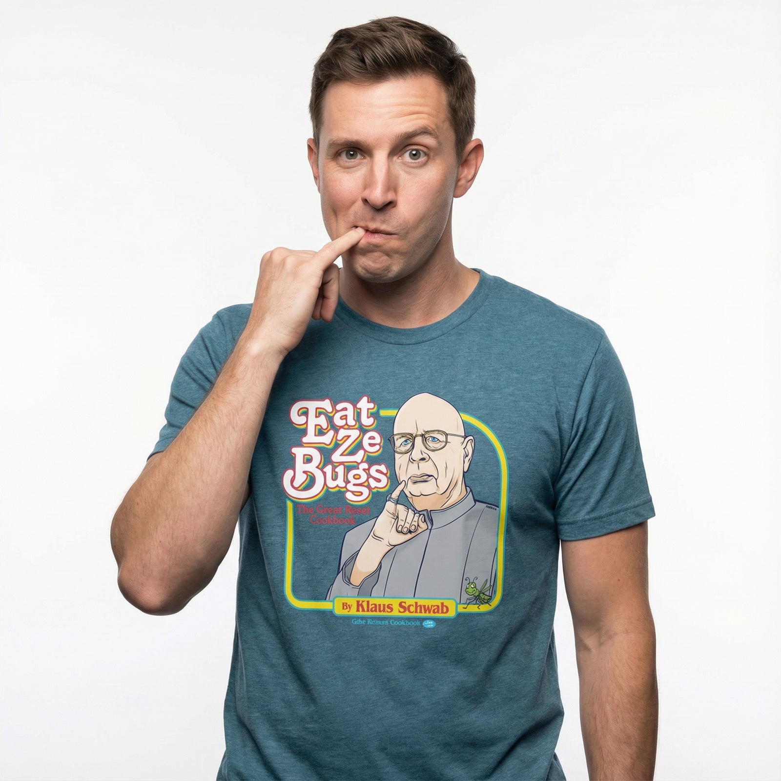 Man wearing a blue t-shirt with a graphic design and text, posing with hand on chin.