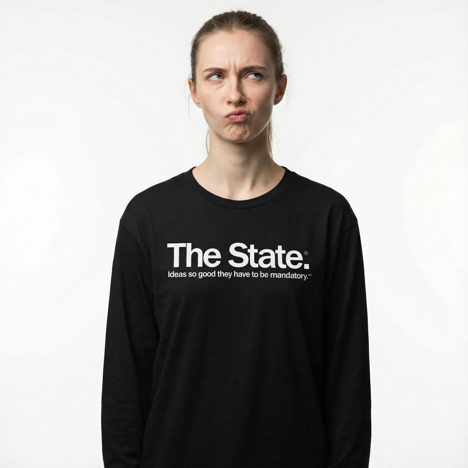 Person wearing a black long-sleeve shirt with 'The State' text on a white background
