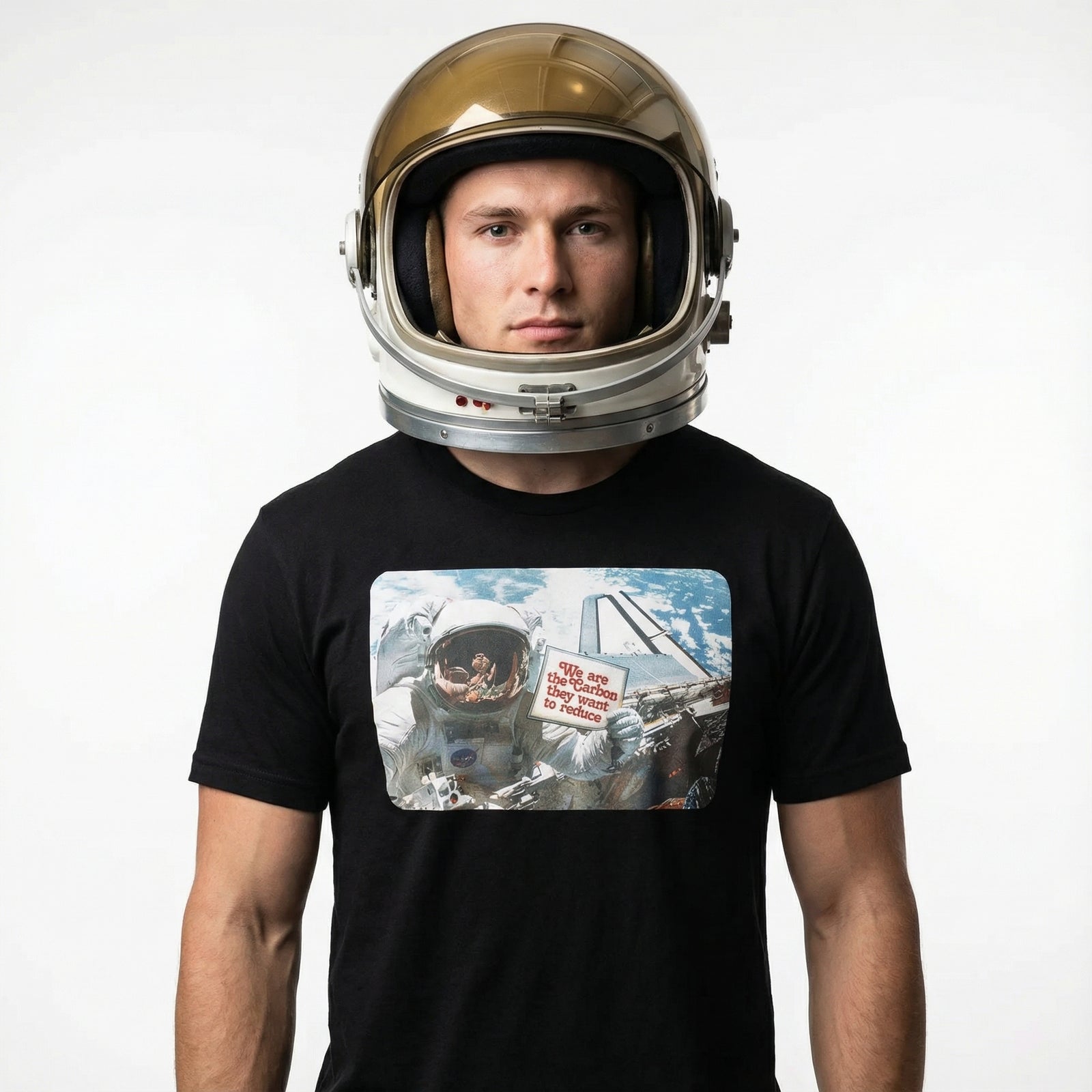 Person wearing a gold astronaut helmet and black t-shirt with space-themed graphic