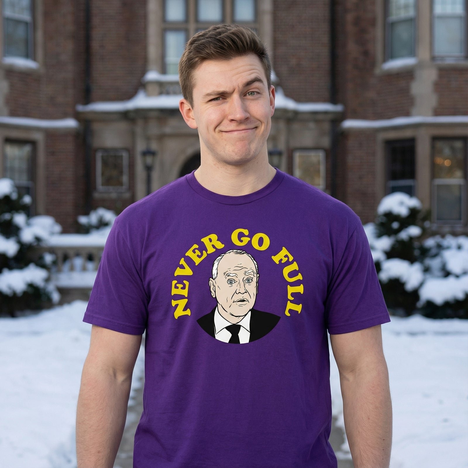 Person wearing a purple t-shirt with a graphic and text in front of a snowy building.