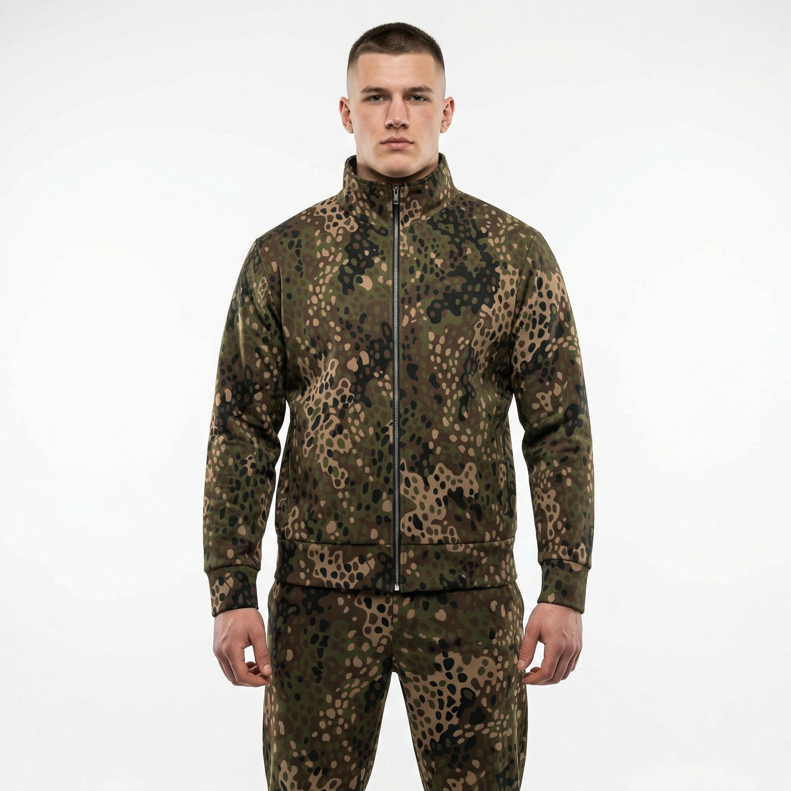 Man wearing a camouflage jacket and pants on a white background