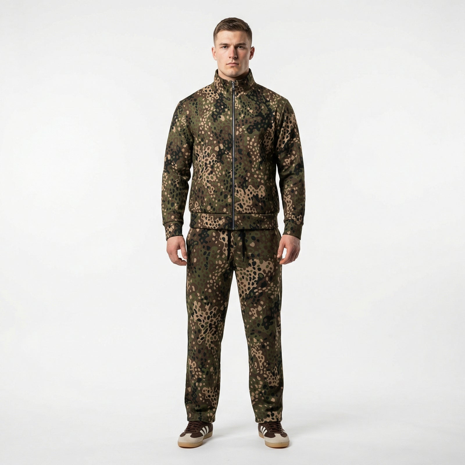 Person wearing a full camouflage outfit on a white background