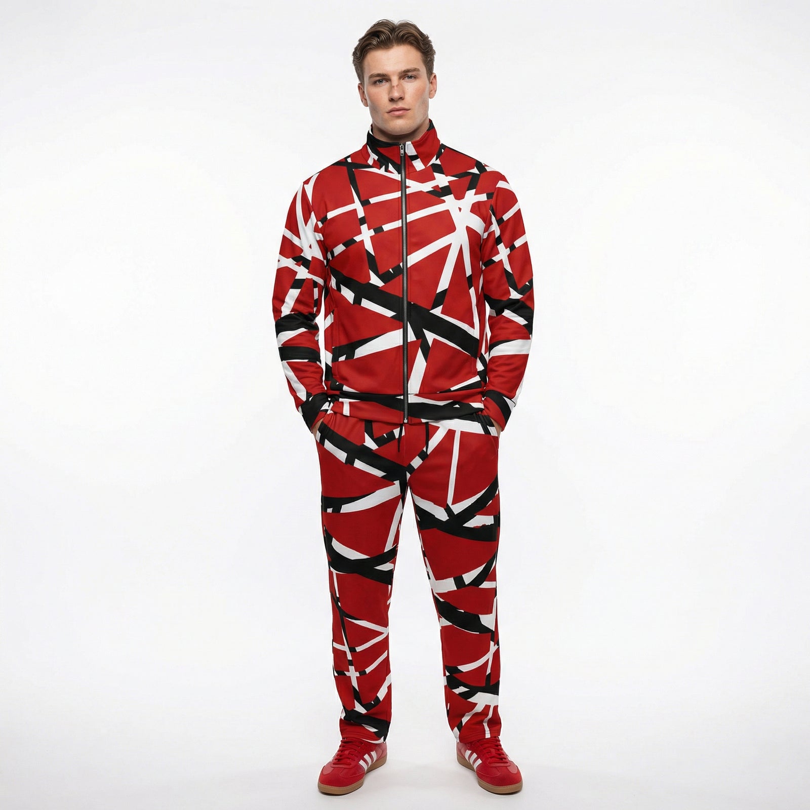 Person wearing a red and black patterned onesie on a white background