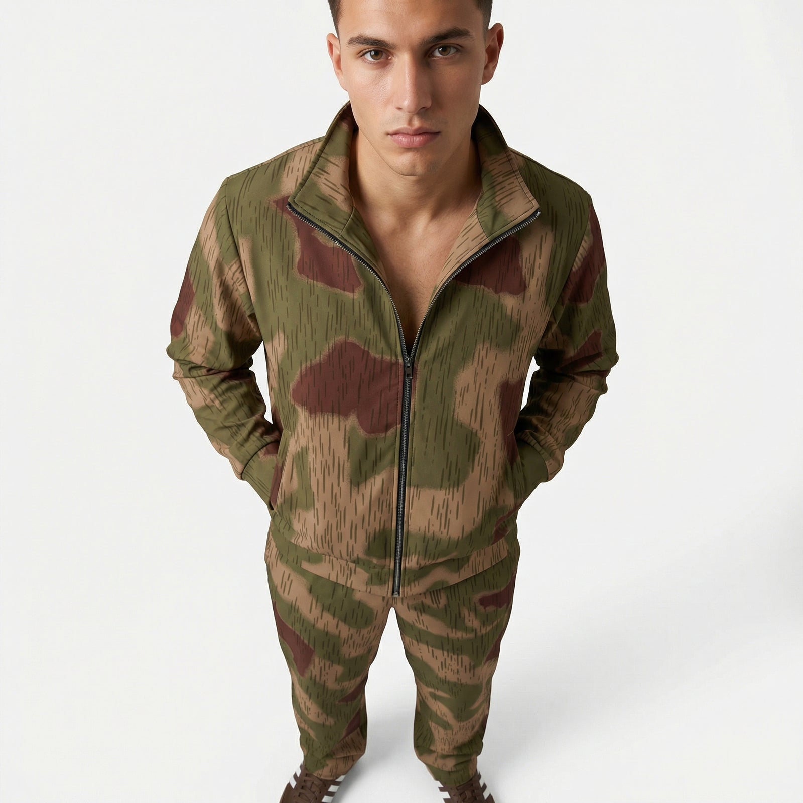 Man wearing a camouflage tracksuit on a white background