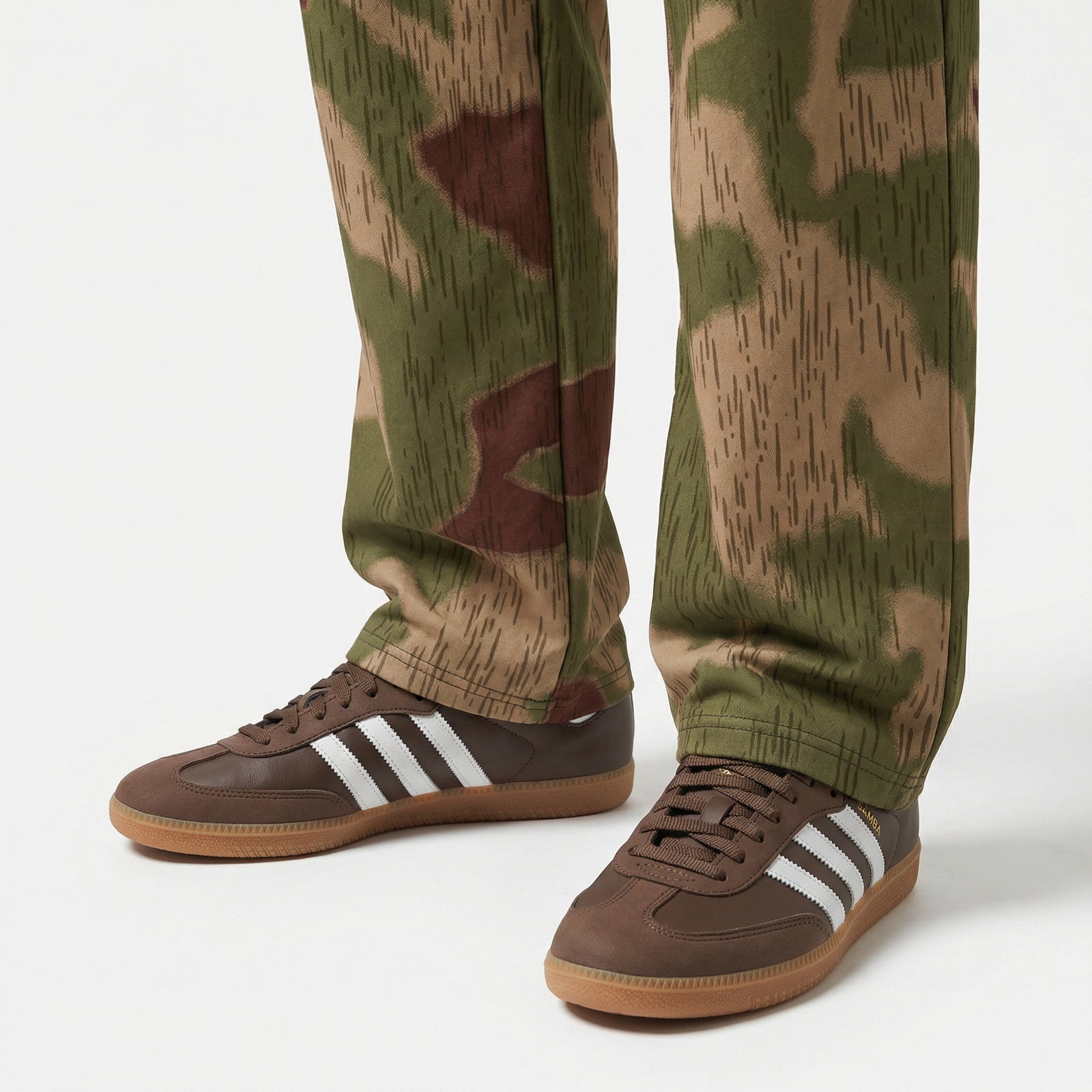 Sumpftarnmuster Camouflage pants with brown Adidas sneakers on a white background