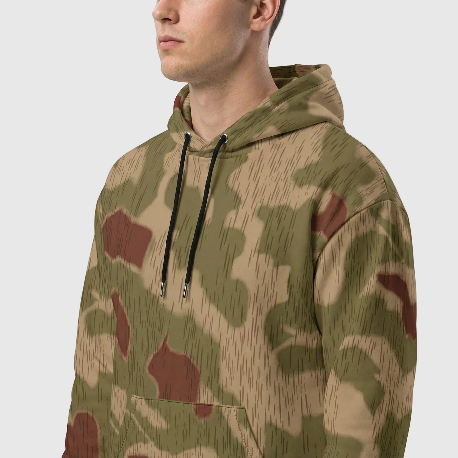 Camouflage hoodie worn by a person on a white background