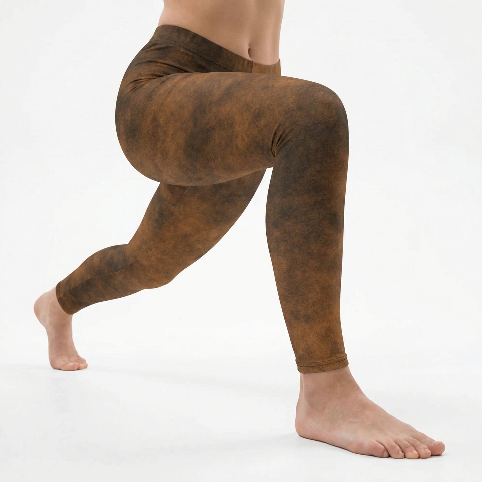 Brown leather textured leggings worn by a person on a white background