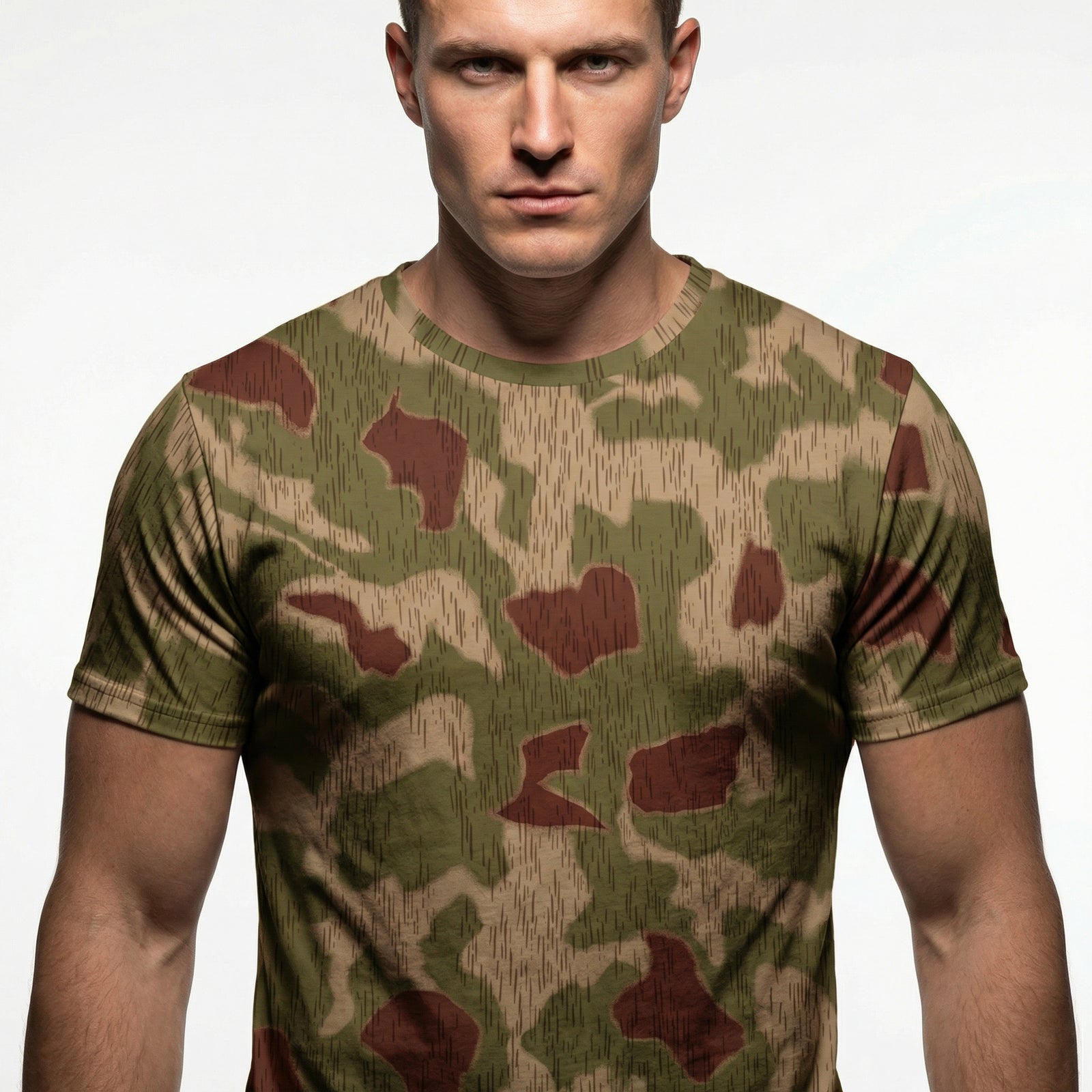 Man wearing a camouflage t-shirt against a plain background