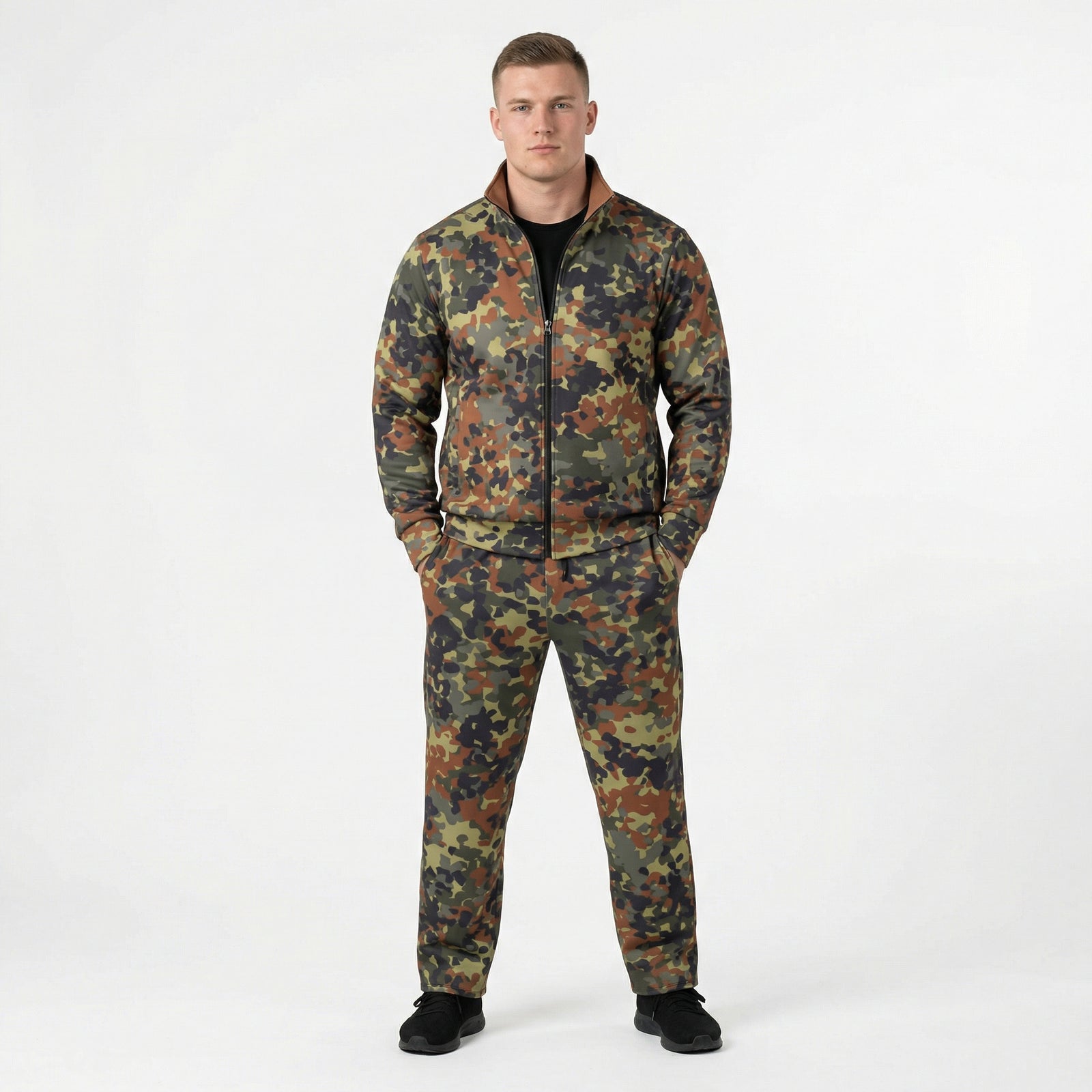 Man wearing a camouflage tracksuit on a white background