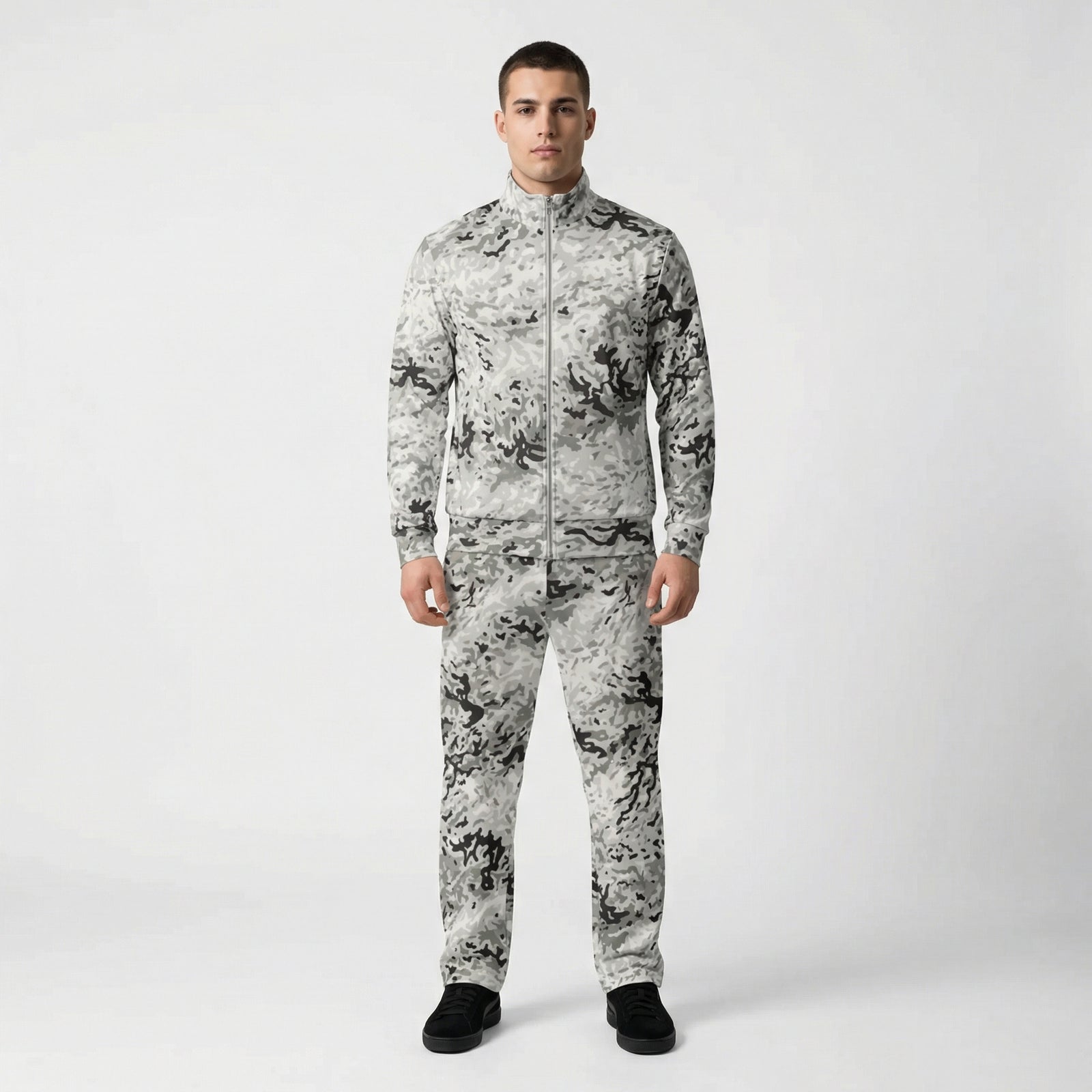 Person wearing a camouflage tracksuit on a white background