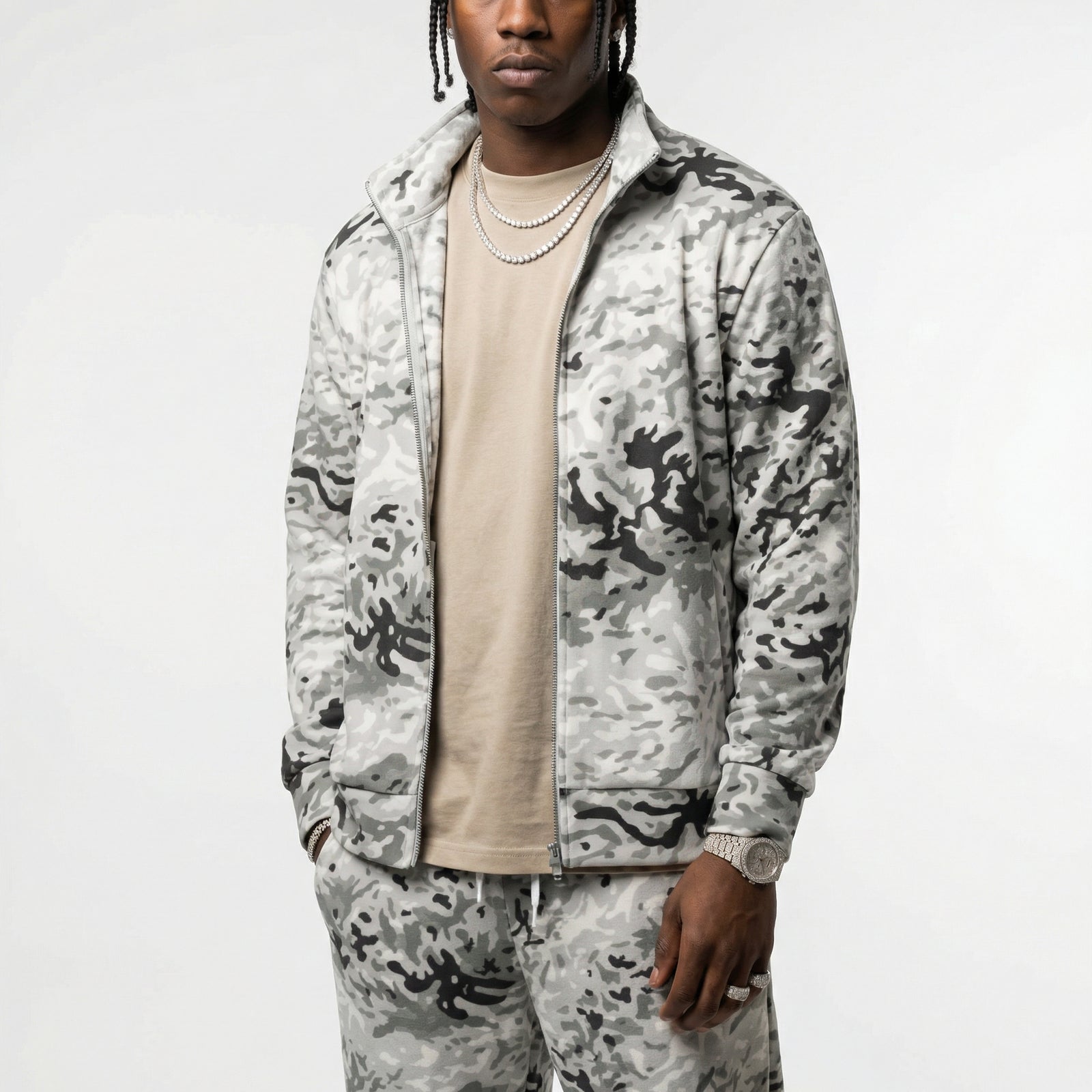 Person wearing a BVON Arctic camouflage tracksuit on a white background