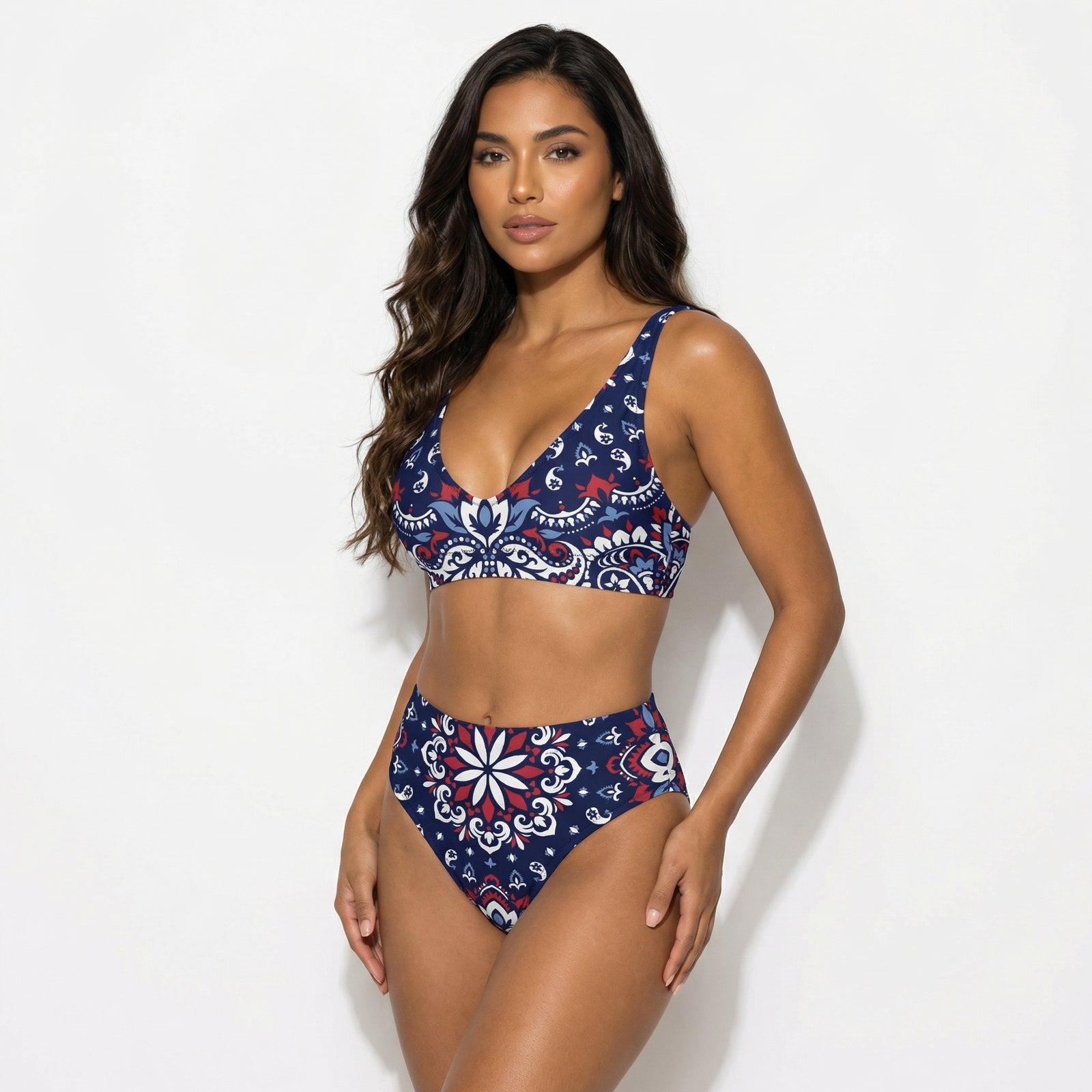 Woman wearing a blue and red patterned bikini on a white background