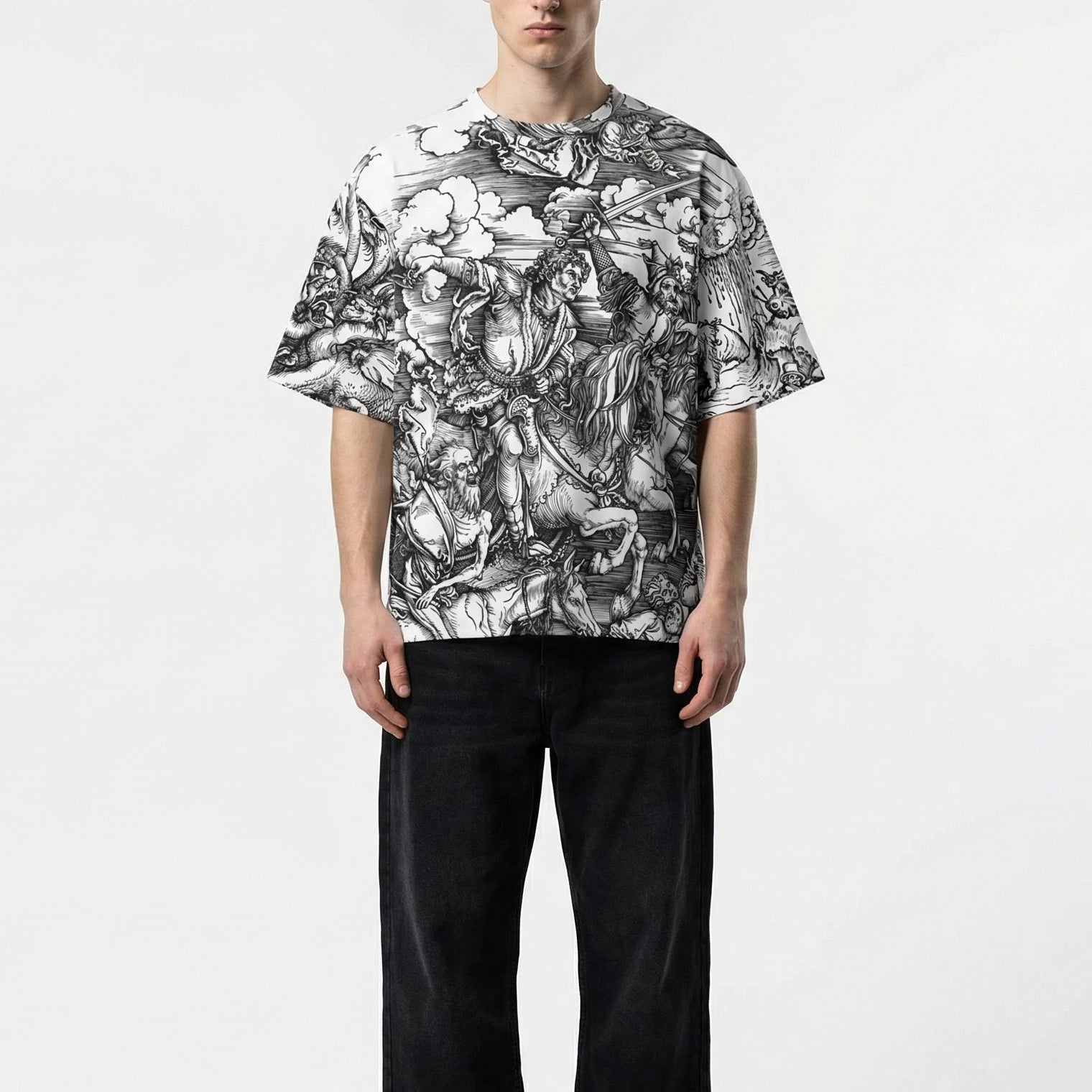 Person wearing a black and white floral patterned shirt on a plain background