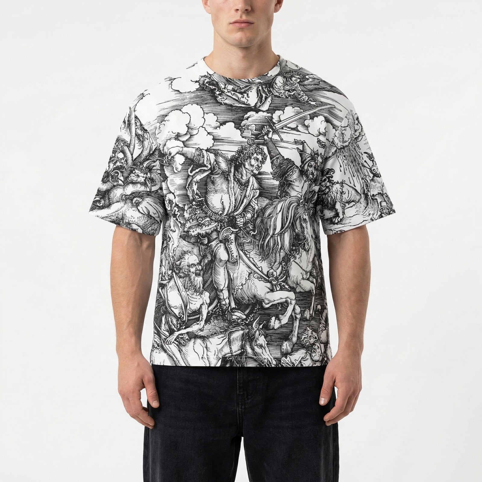 Person wearing a t-shirt with a black and white graphic design on a plain background