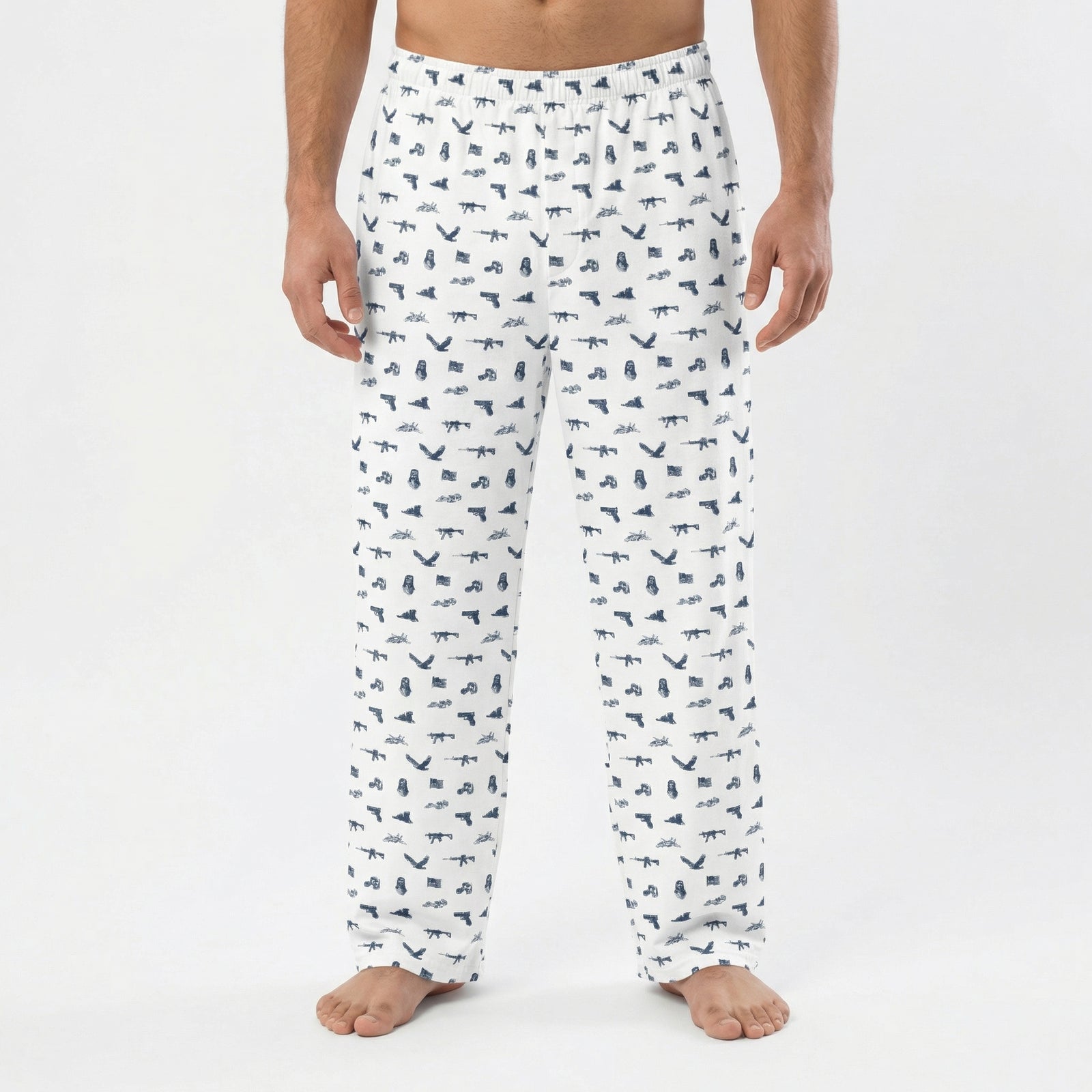 White pajama pants with black animal pattern worn by a person on a white background