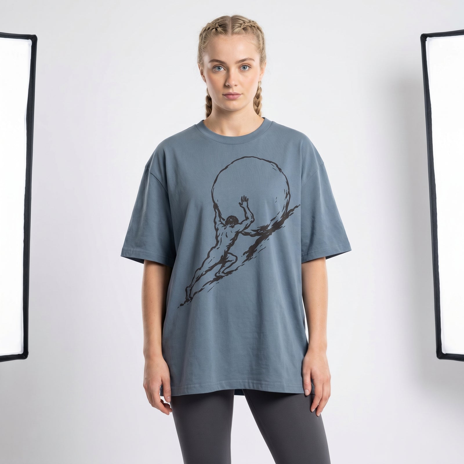 Woman wears a Sisyphus Garment Dyed Organic Graphic T-Shirt