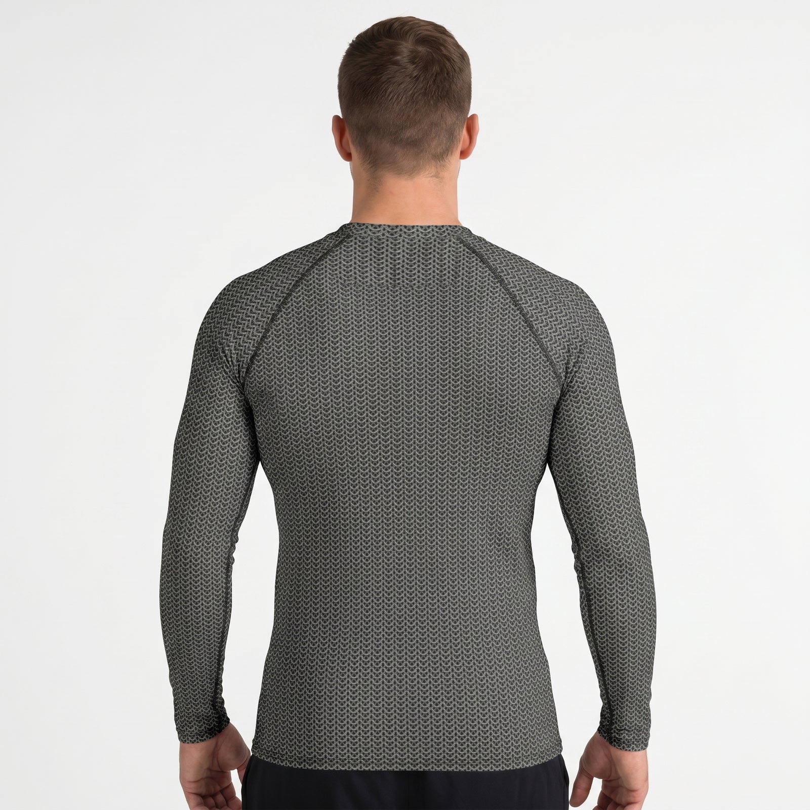 Man wearing a gray long-sleeve shirt with a subtle pattern on a white background