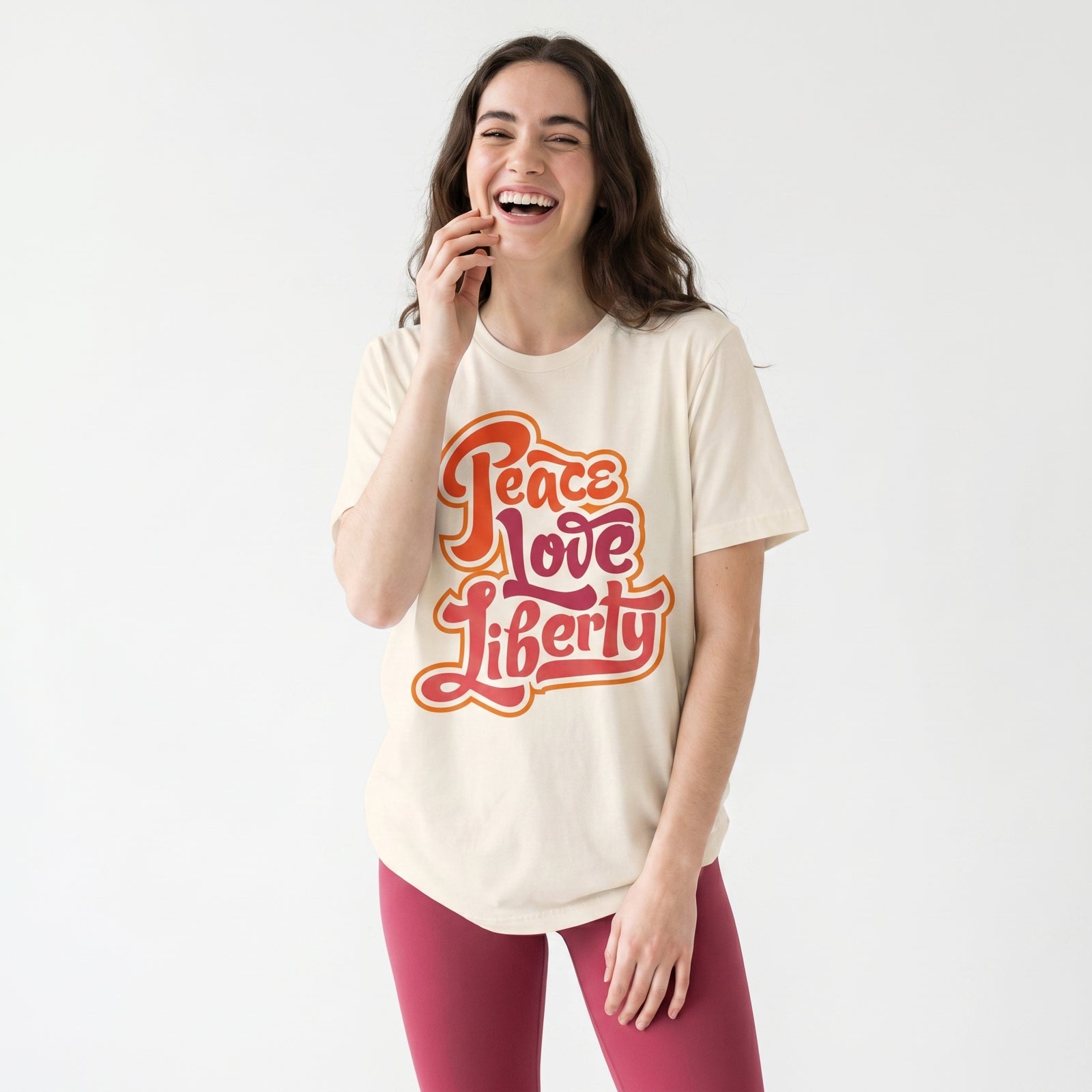 Woman wearing a 'Peace Love Liberty' t-shirt on a white background